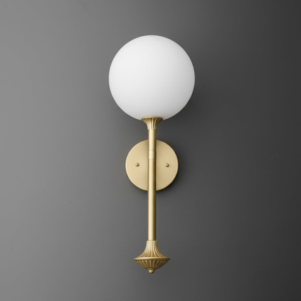 Wall sconce with a round white glass globe and a brushed brass vertical rod and base. - SCONCE MODEL NO. 1059