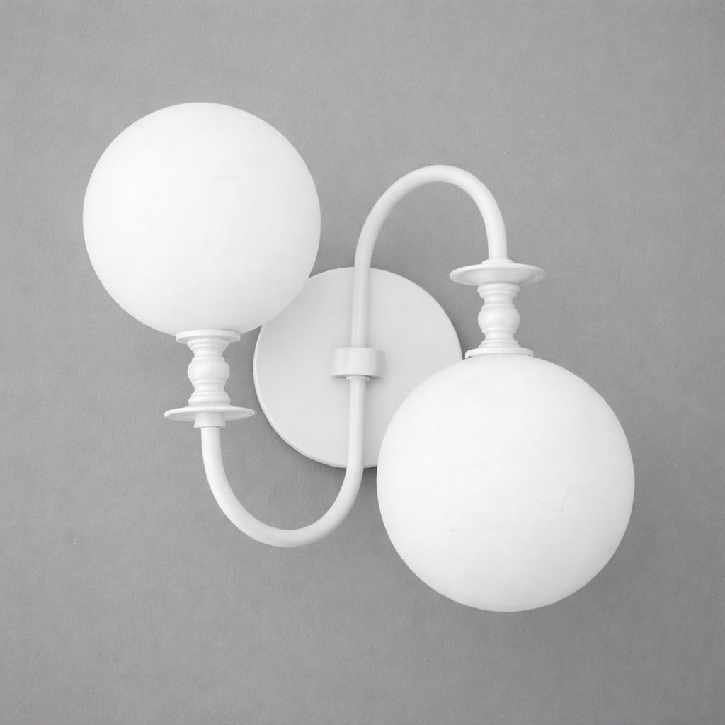 White double globe wall sconce with curved arms and round backplate in matte finish. - SCONCE MODEL NO. 2429