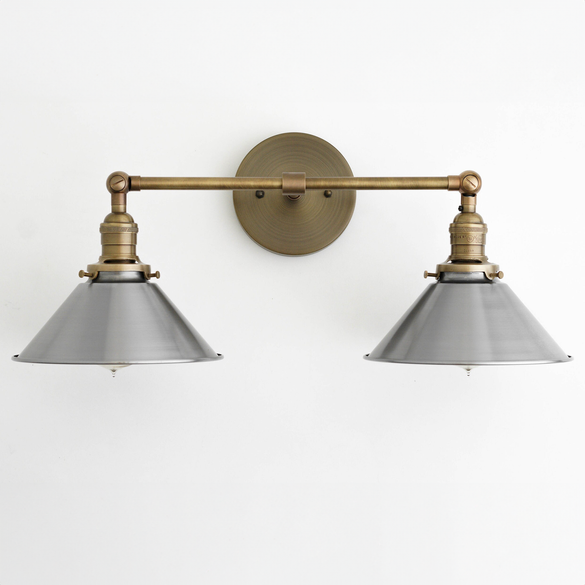 Industrial-style two-bulb vanity light with antique brass finish and gray metal shades. - VANITY LIGHT MODEL NO. 0799