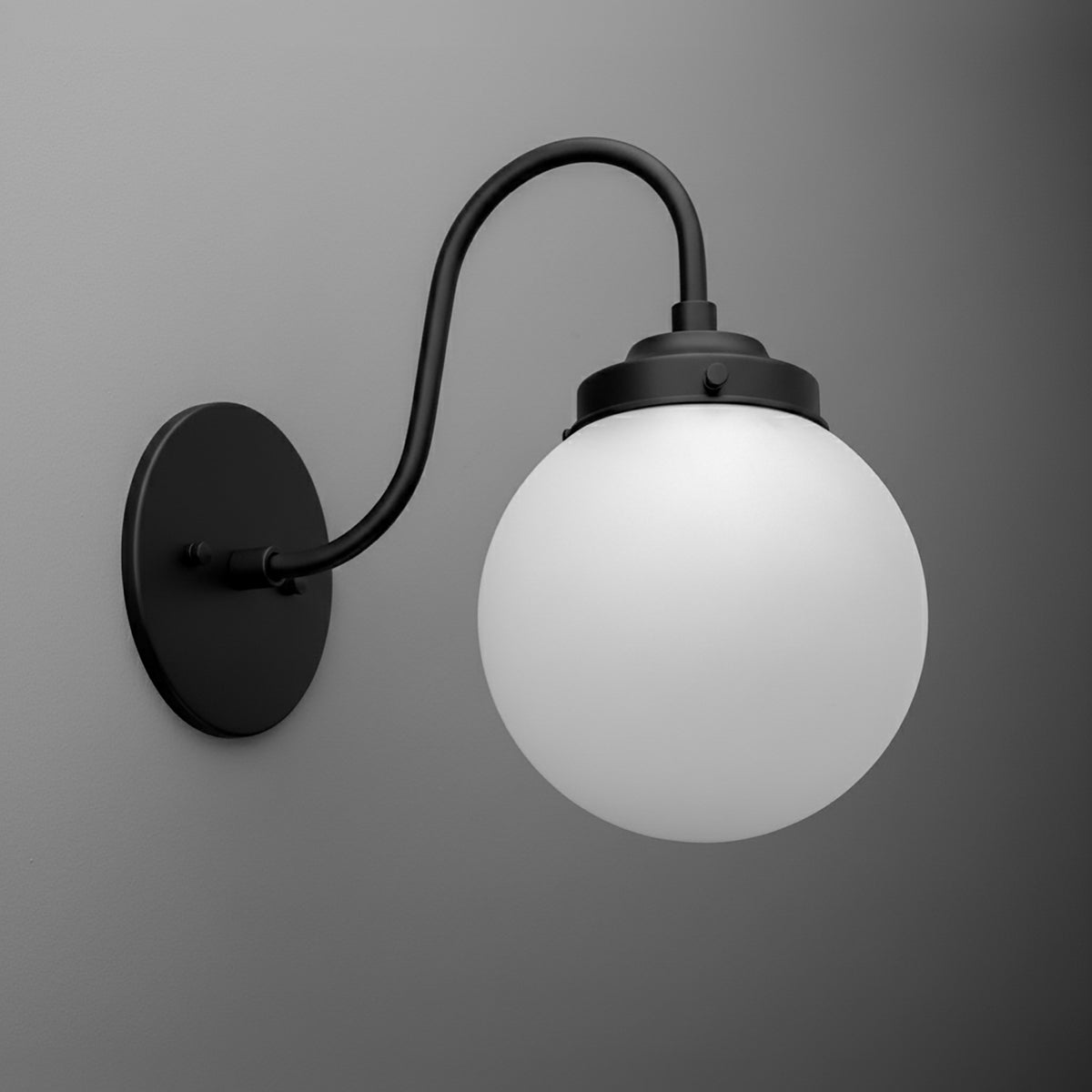 Matte black metal wall sconce with curved arm and white frosted glass globe shade. - SCONCE MODEL NO. 1886