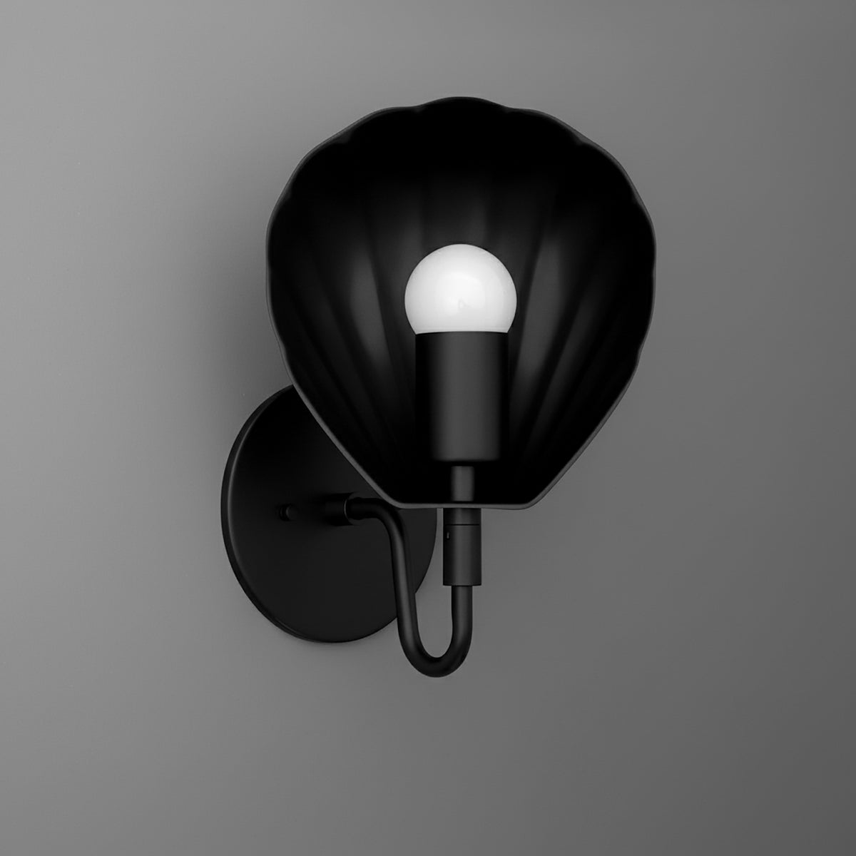 Black metal wall sconce with scalloped, shell-shaped shade and exposed round bulb. - SCONCE MODEL NO. 1086