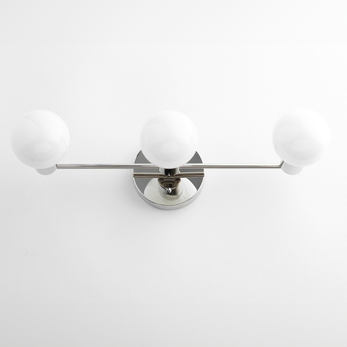 Mid-century modern vanity light with three white glass globe bulbs and polished nickel finish. - VANITY LIGHT MODEL NO. 0518