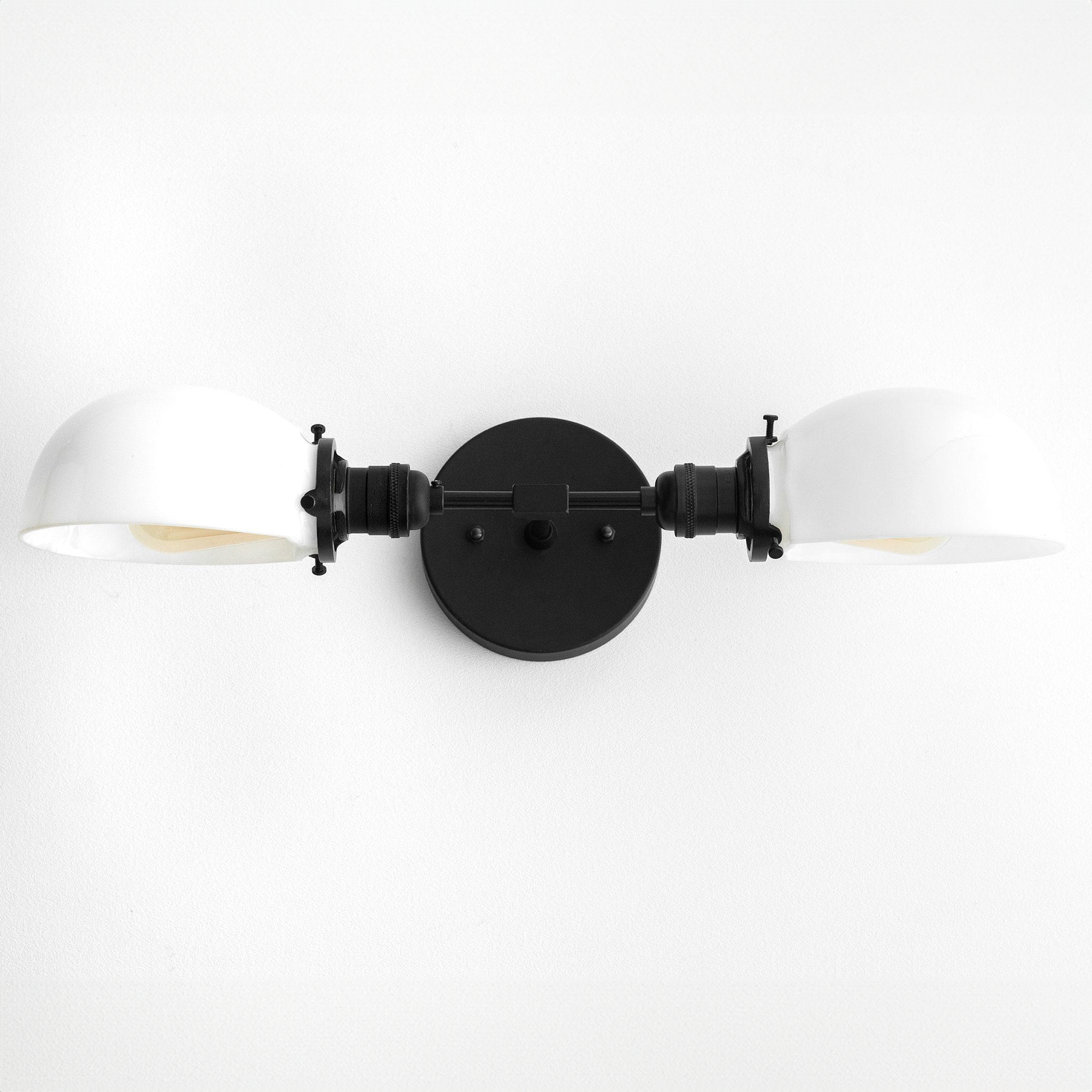 Mid-century modern black vanity light with two white dome-shaped shades and circular mounting plate. - VANITY LIGHT MODEL NO. 1734