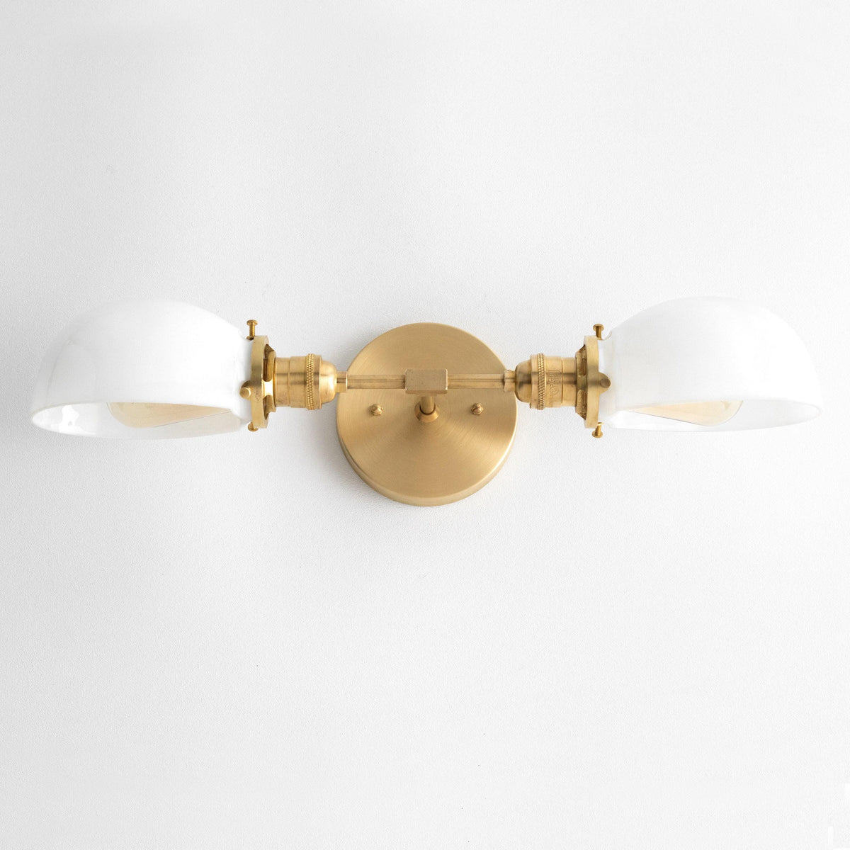 Mid-century modern two-bulb vanity light with antique brass finish and white glass shades. - VANITY LIGHT MODEL NO. 1734
