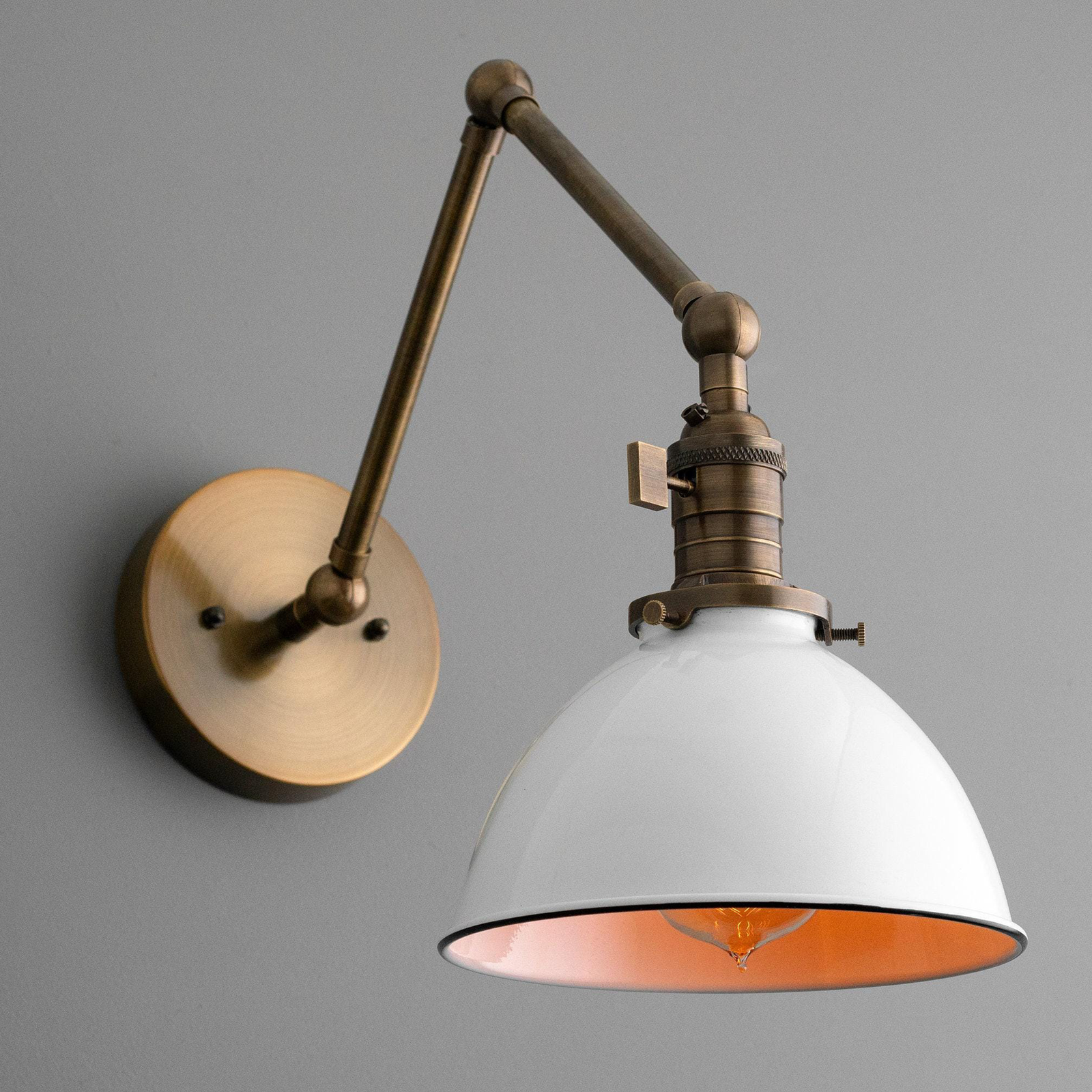 Mid-century modern adjustable wall sconce with raw brass finish and white dome shade. - SCONCE MODEL NO. 8551