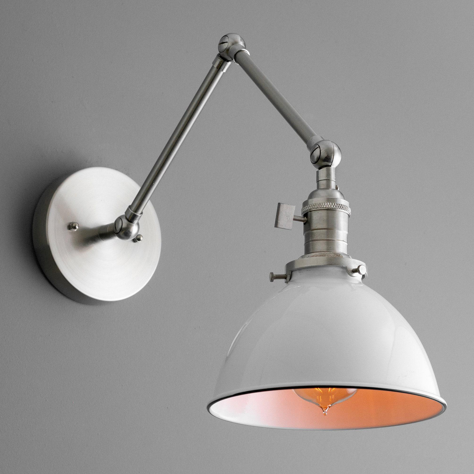 Adjustable mid-century modern brushed nickel wall sconce with white dome shade and visible bulb. - SCONCE MODEL NO. 8551