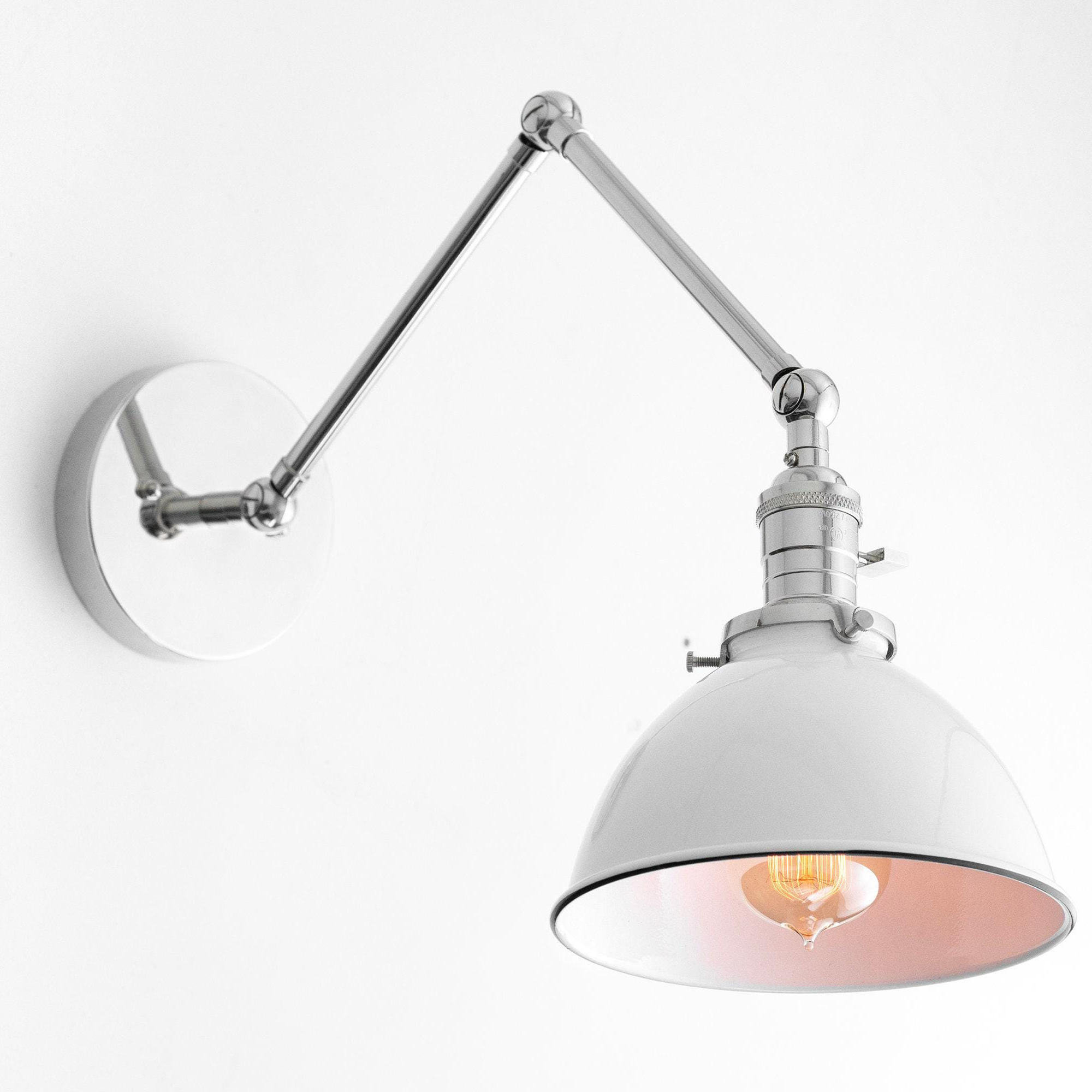 Polished nickel adjustable wall sconce with white metal shade and exposed bulb in mid-century modern style. - SCONCE MODEL NO. 8551