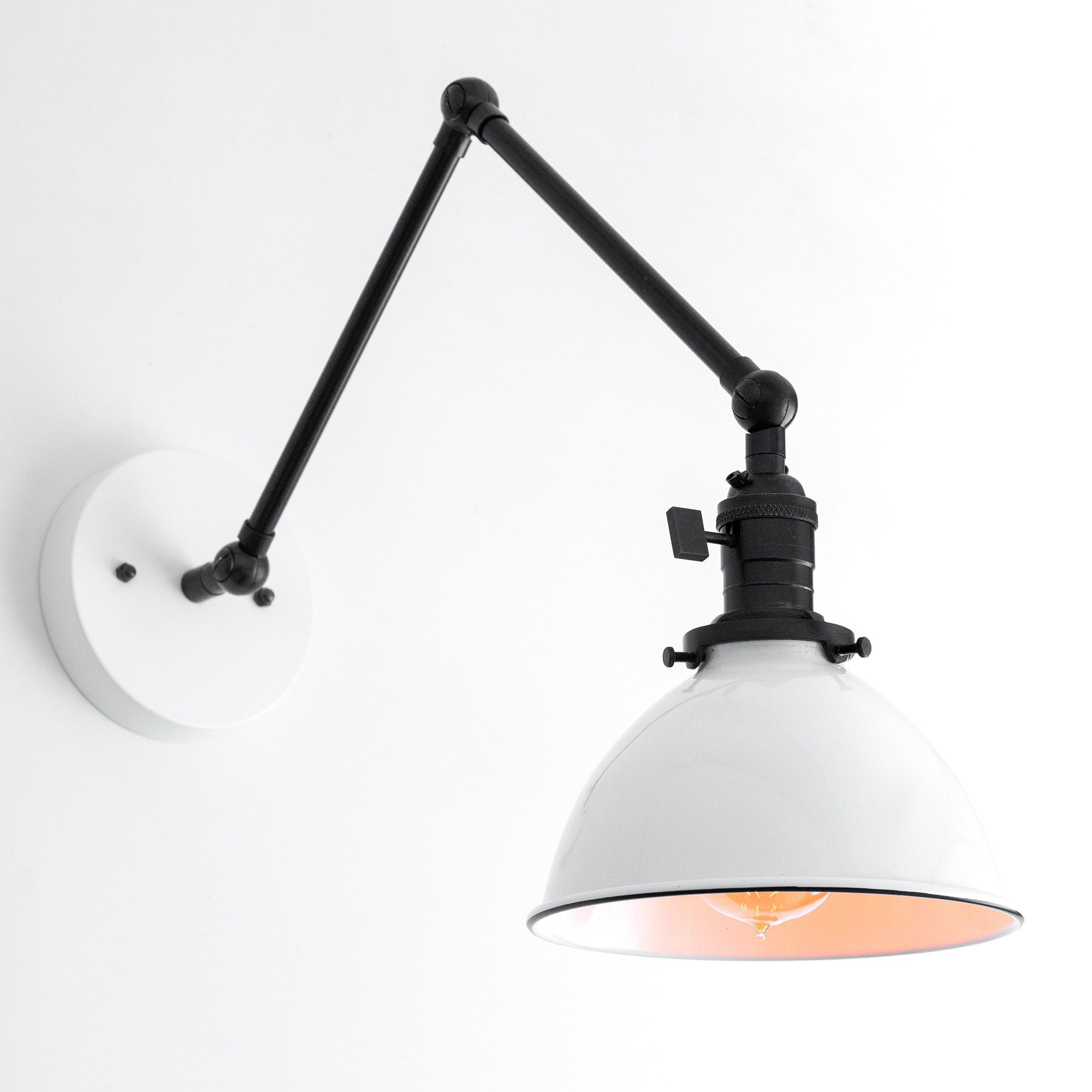 Black adjustable mid-century modern wall sconce with white metal shade and matte black arm. - SCONCE MODEL NO. 8551