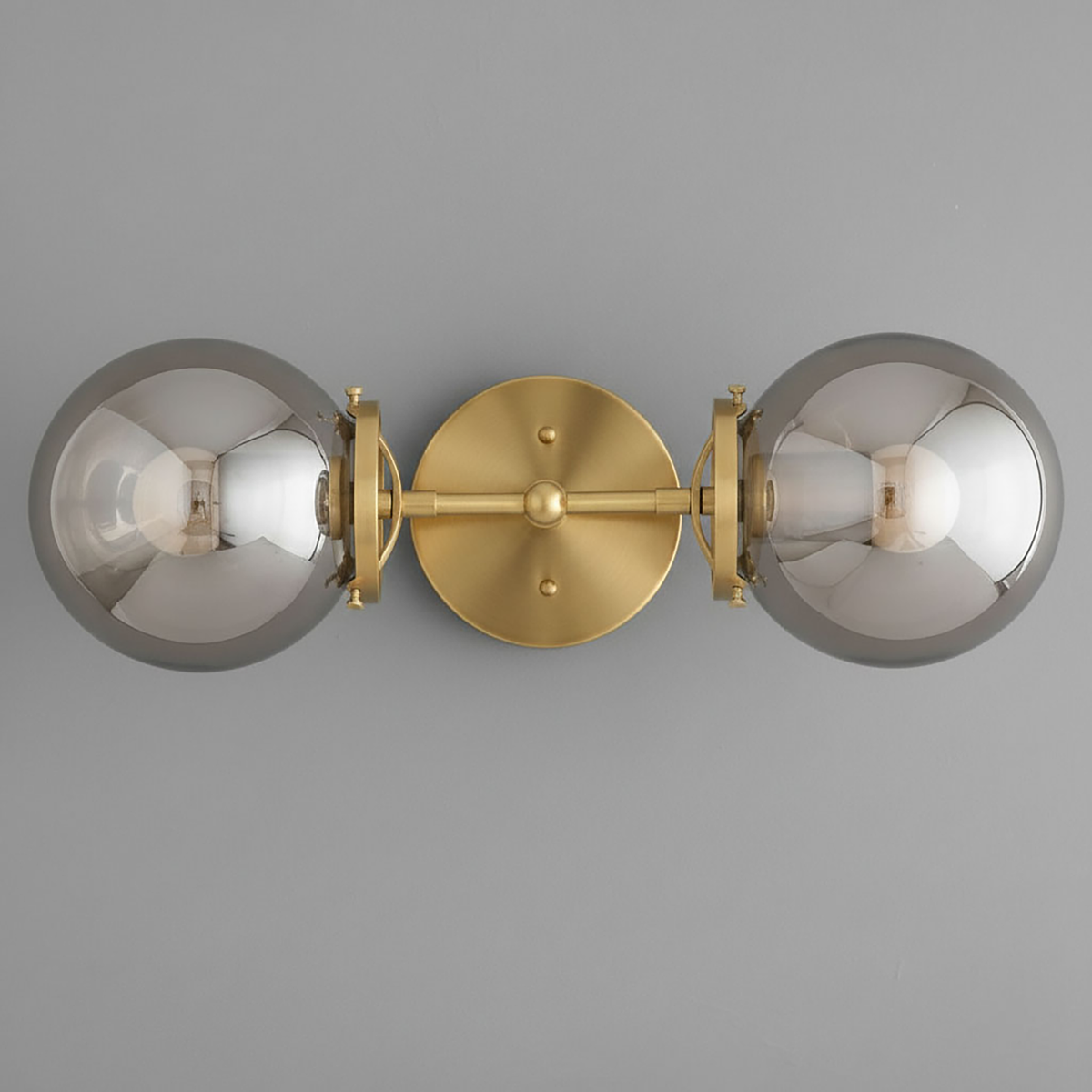 Mid-century modern 2-bulb vanity light with antique brass finish and smoky glass globe shades. - VANITY LIGHT MODEL NO. 8983