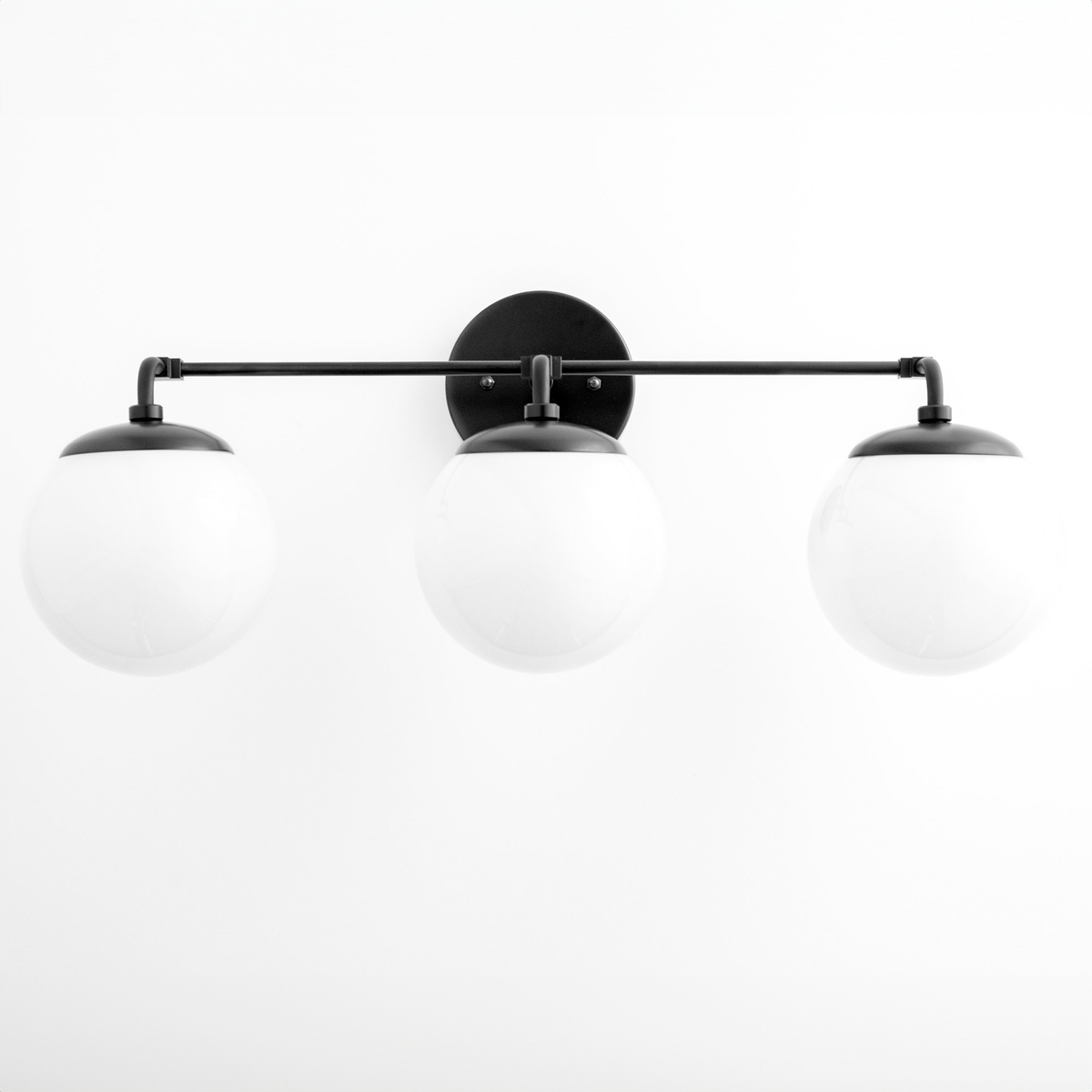 Black modern vanity light with three white globe shades on a horizontal bar. - VANITY LIGHT MODEL NO. 9319