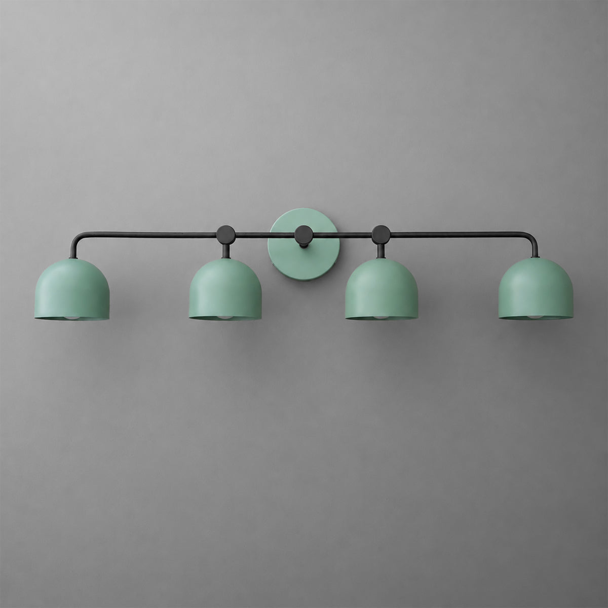 Four-light vanity light in Black with Green dome shades and a matching Green wall plate. - VANITY LIGHT MODEL NO. 1124