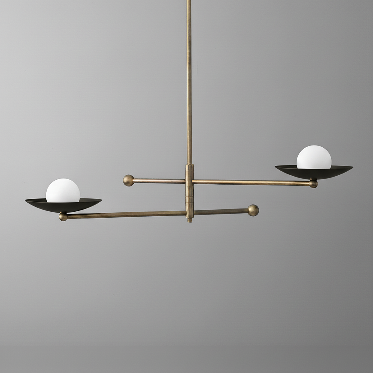Mid-century modern chandelier with antique brass arms and two black metal dishes holding white globe bulbs. - CHANDELIER MODEL NO. 2933