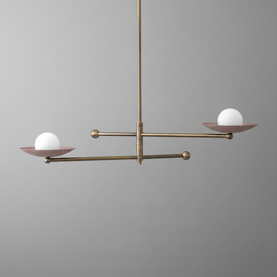 Antique brass chandelier with two mauve metal arms, each holding a white globe light. - CHANDELIER MODEL NO. 2933