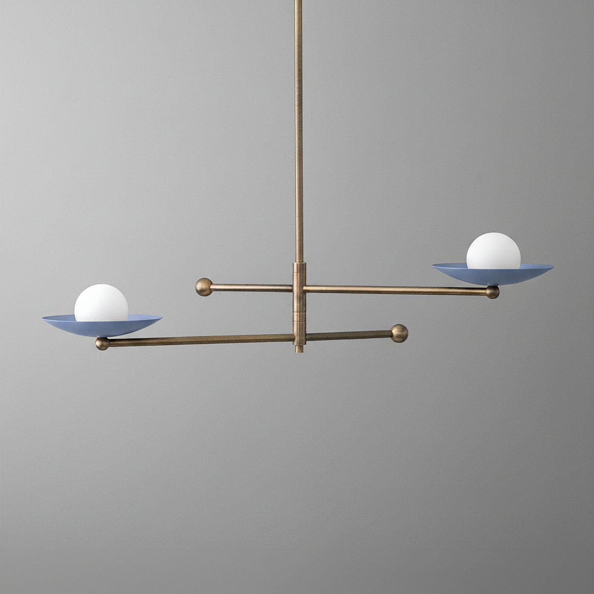 Antique brass chandelier with two horizontal arms and round white globe lights on blue metal dishes. - CHANDELIER MODEL NO. 2933