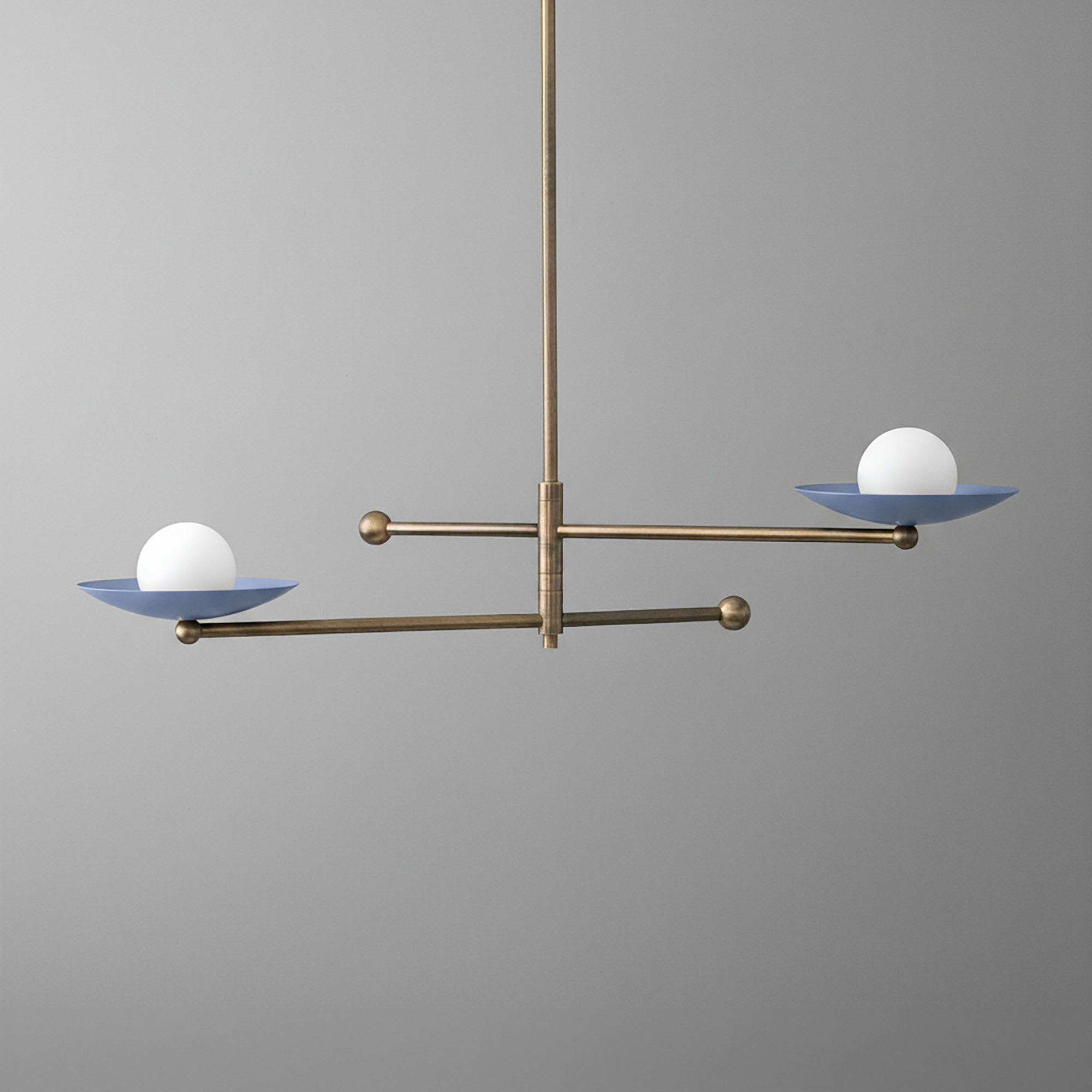 Antique brass chandelier with two horizontal arms and round white globe lights on blue metal dishes. - CHANDELIER MODEL NO. 2933