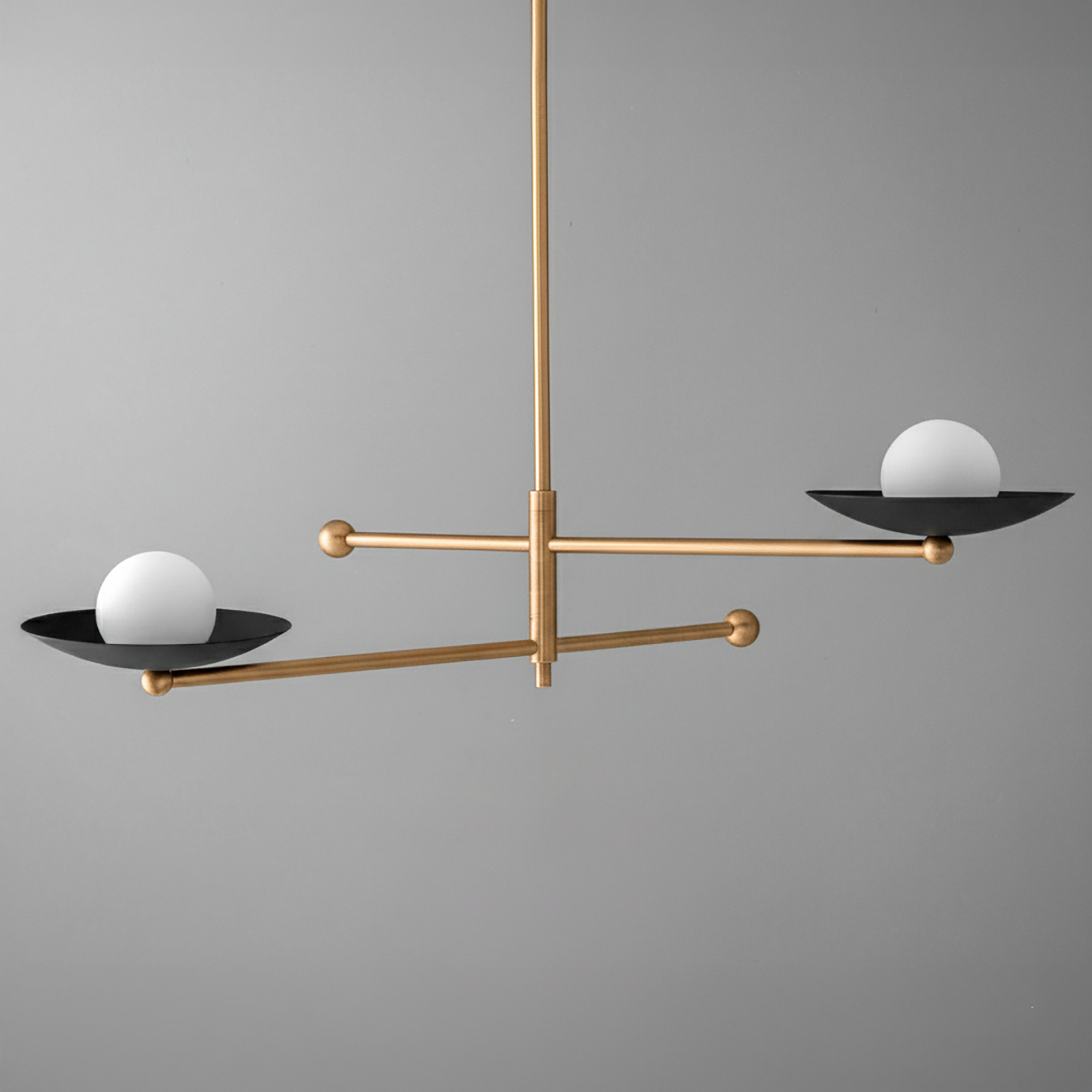 Mid-century modern swivel chandelier with raw brass finish and black metal globes with white orbs. - CHANDELIER MODEL NO. 2933