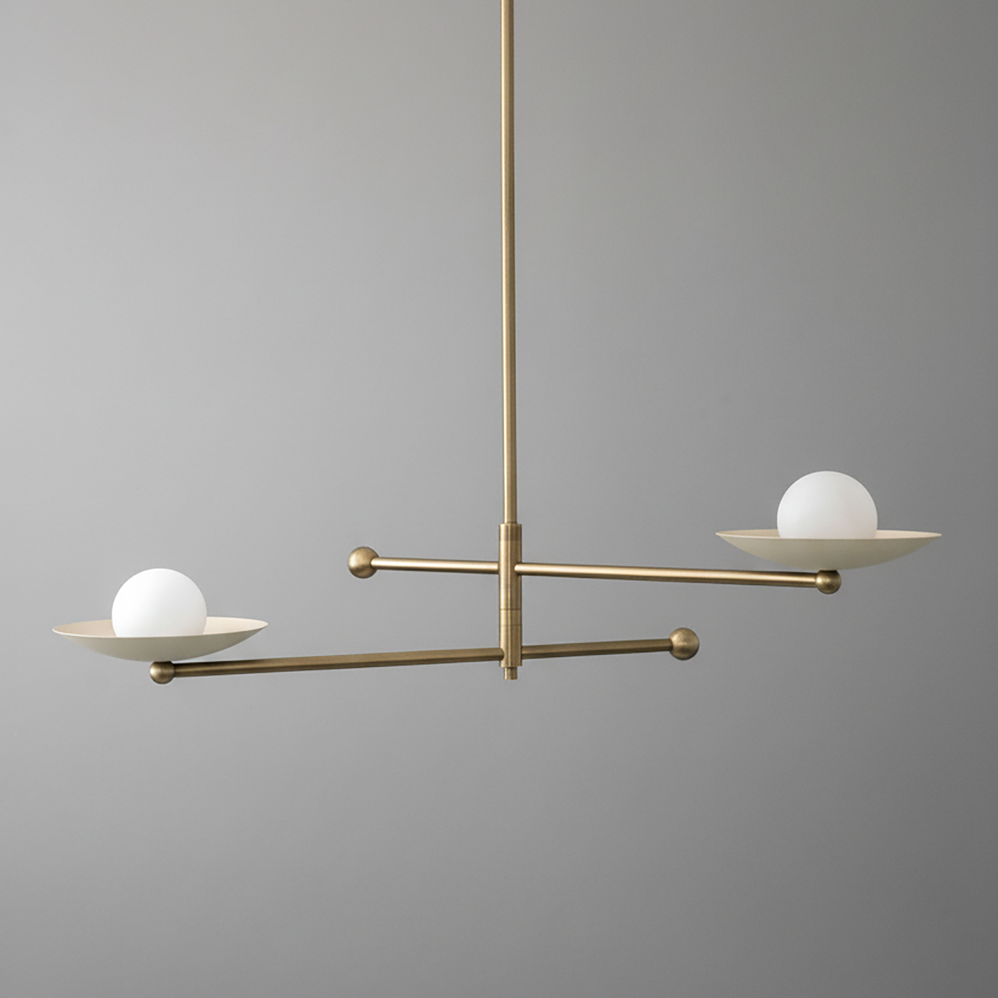 Mid-century modern antique brass chandelier with two white globe lights on flat circular arms. - CHANDELIER MODEL NO. 2933