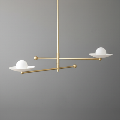 Mid-century modern chandelier with two white globe lights on matte brass swivel arms against gray background. - CHANDELIER MODEL NO. 2933
