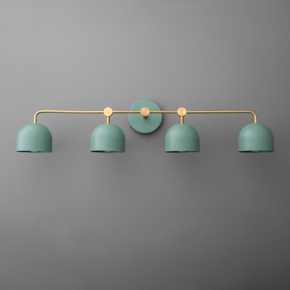 Four-light vanity light in Raw or Sealed Brass with Green dome shades and a matching Green wall plate. - VANITY LIGHT MODEL NO. 1124
