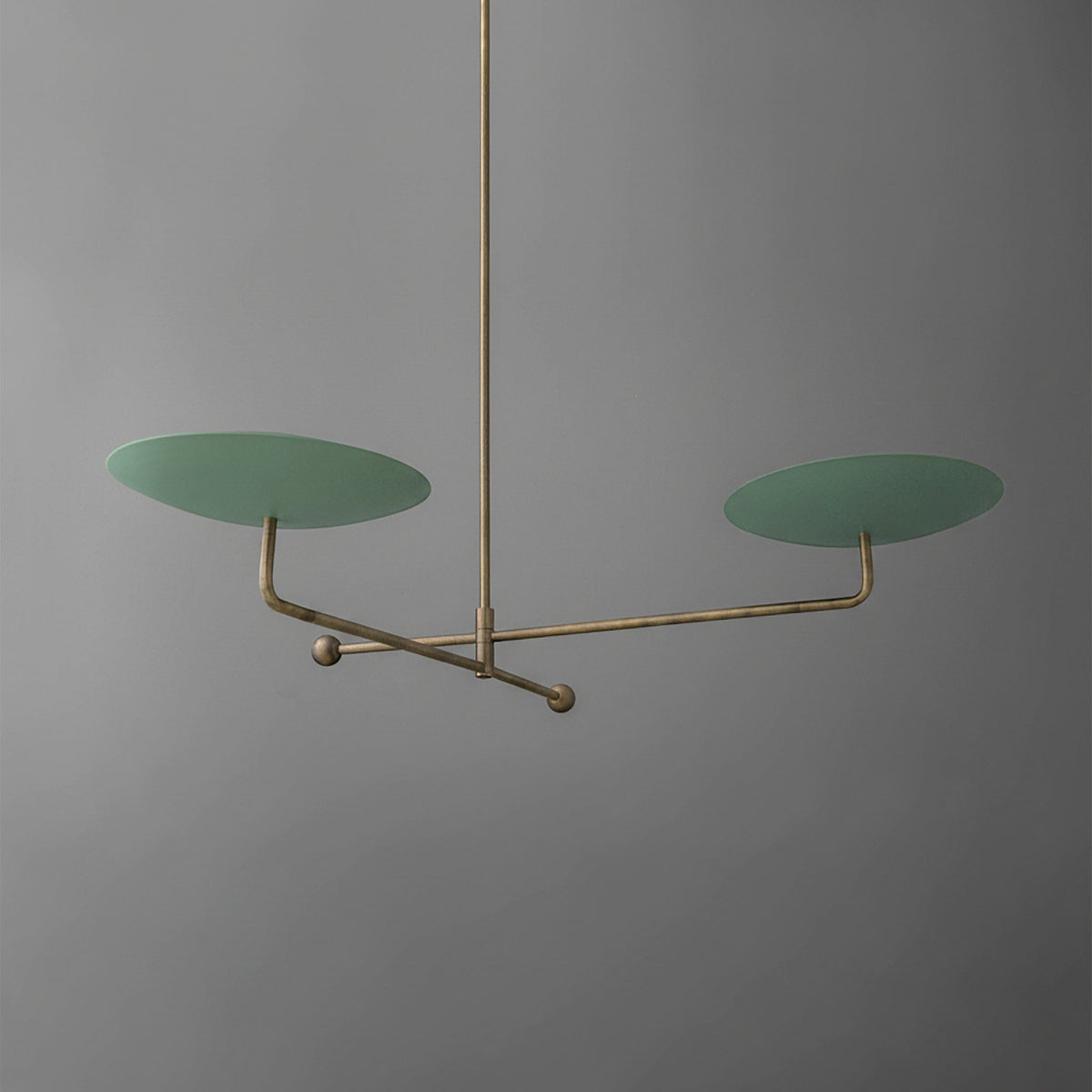 Minimalist chandelier with two large flat green discs on a thin brass frame and central rod. - CHANDELIER MODEL NO. 0680