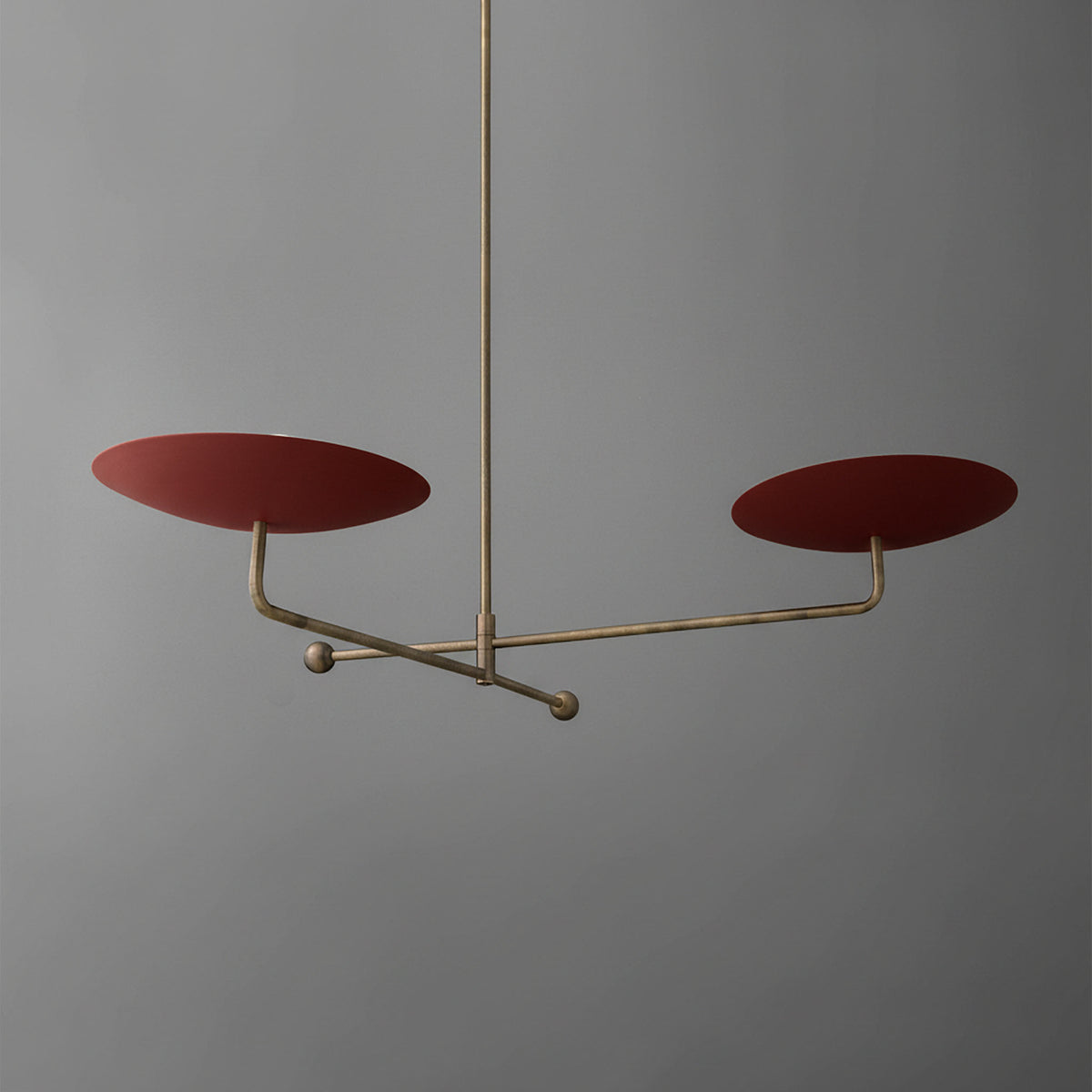 Antique brass chandelier with two horizontal arms and flat brick red disc shades. - CHANDELIER MODEL NO. 0680