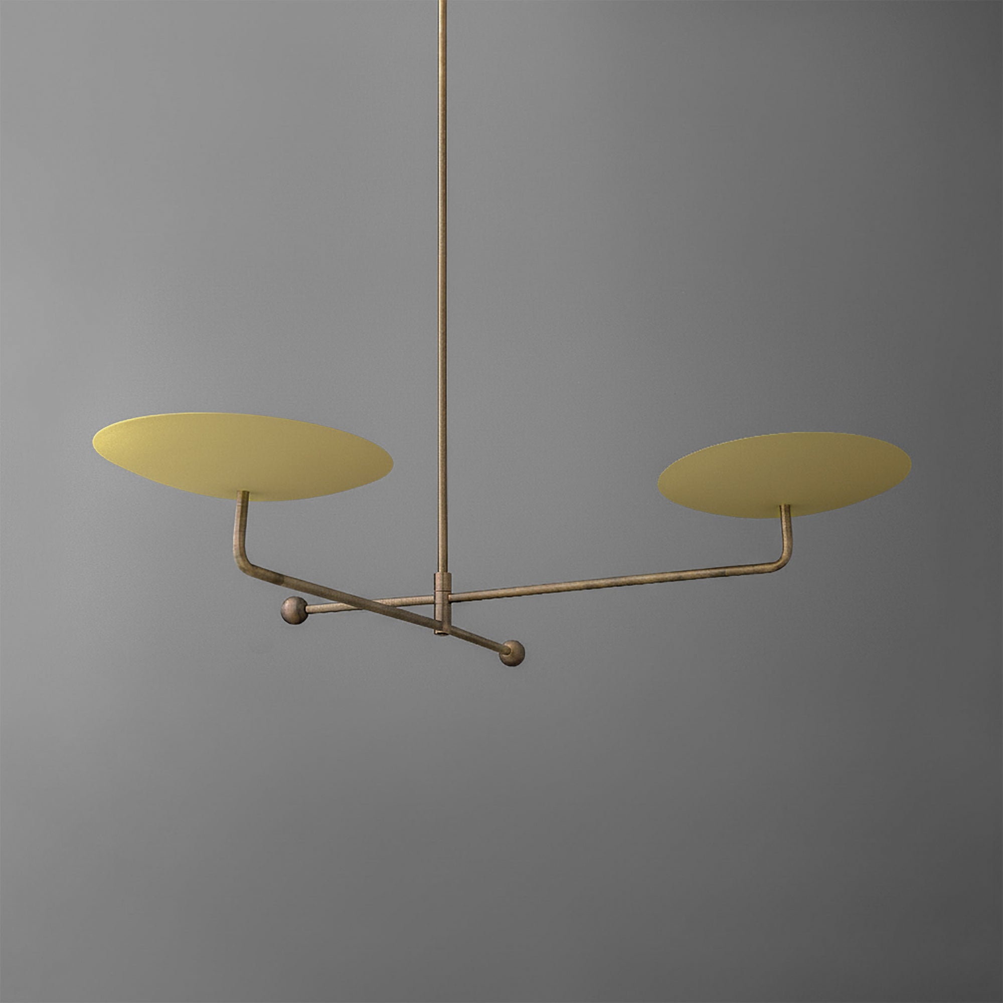 Minimalist chandelier with two large matte gold discs on horizontal brass arms against a gray background. - CHANDELIER MODEL NO. 0680