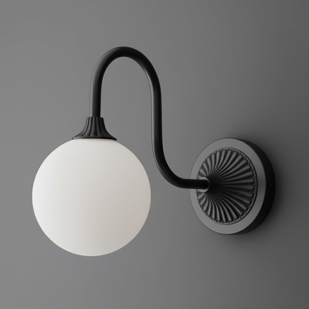 Black metal wall sconce with curved arm and round white frosted glass globe shade. - SCONCE MODEL NO. 1085