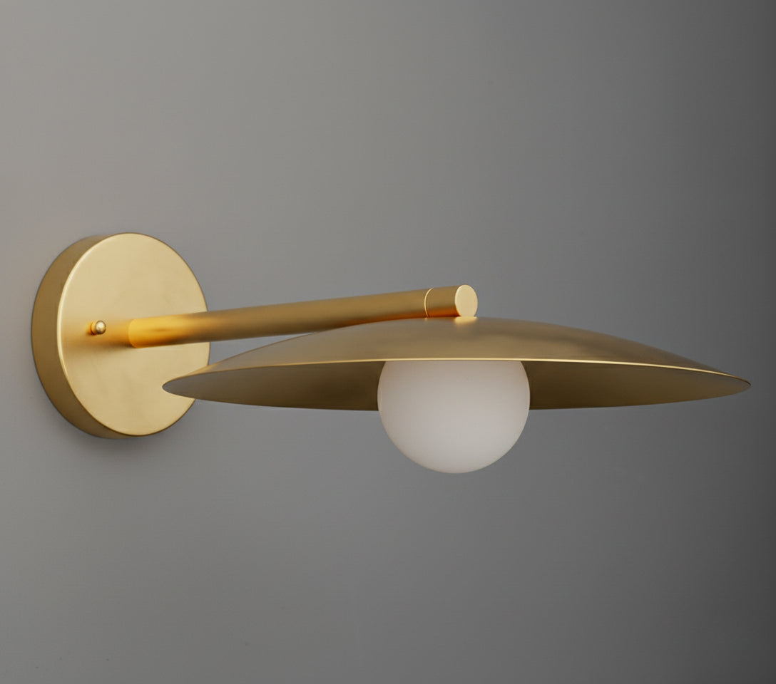 Sconce in Raw or Sealed Brass with a wide shallow dish shade over an opal glass globe, on a straight arm from a round wall plate. - SCONCE MODEL NO. 1076