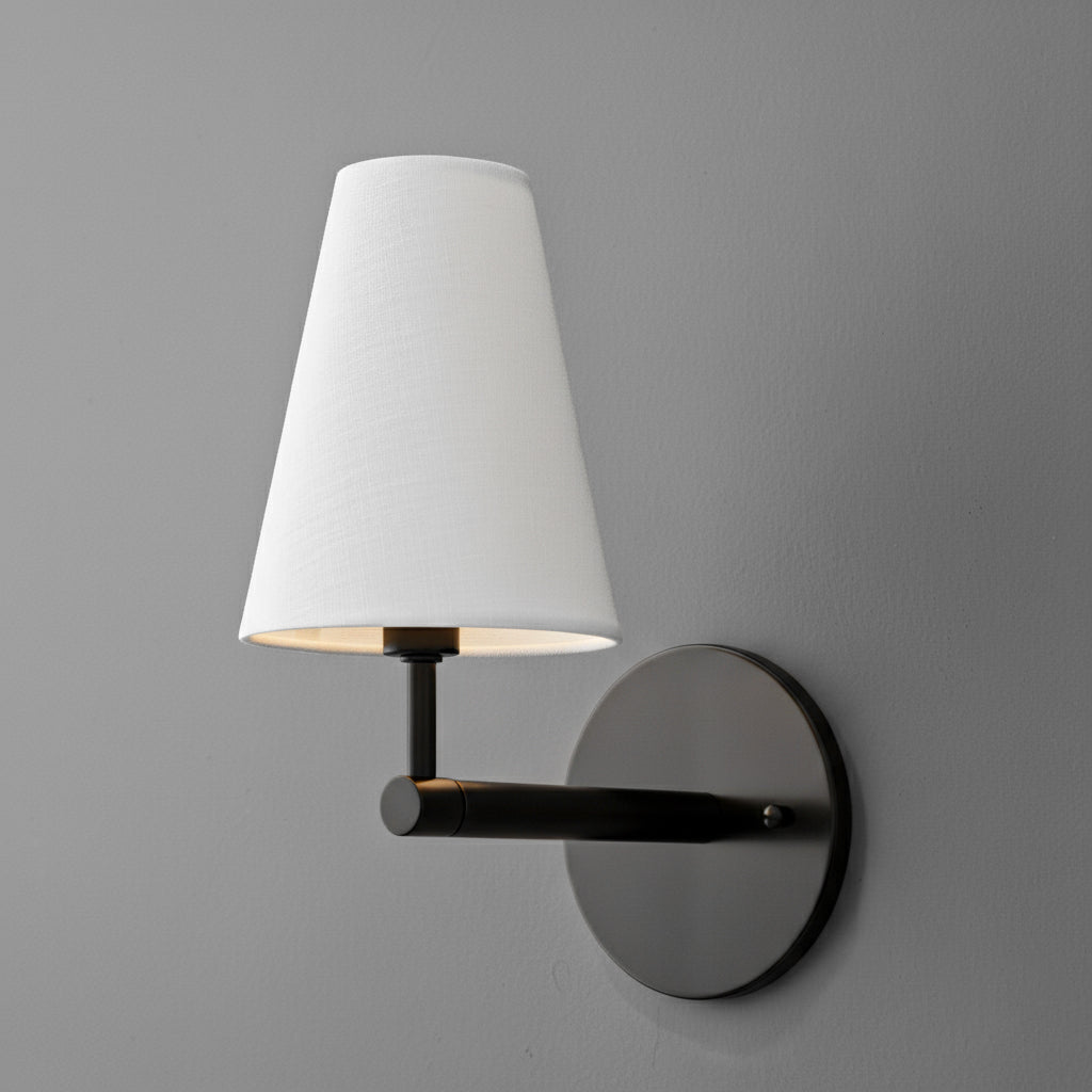 Black metal wall sconce with round base and white tapered fabric lampshade. - SCONCE MODEL NO. 1014