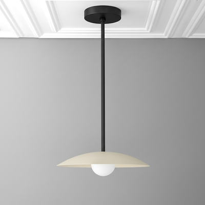 Mid-century modern pendant light with matte black rod and cream disc shade over white globe bulb. - PENDANT MODEL NO. 4085