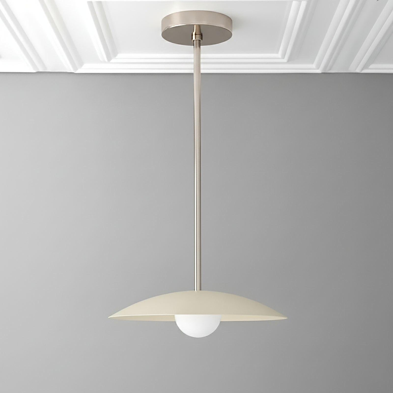 Antique brass pendant light with cream dome shade and white globe bulb suspended from ceiling mount. - PENDANT MODEL NO. 4085