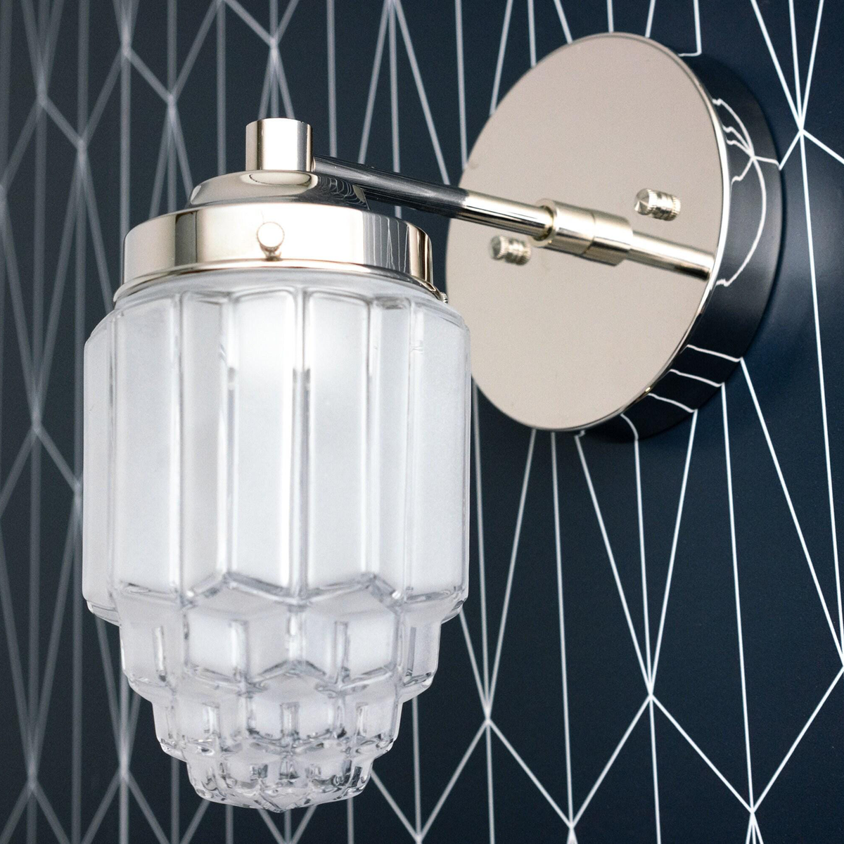 Polished nickel Art Deco wall sconce with tiered frosted glass globe and round backplate. - SCONCE MODEL NO. 6130
