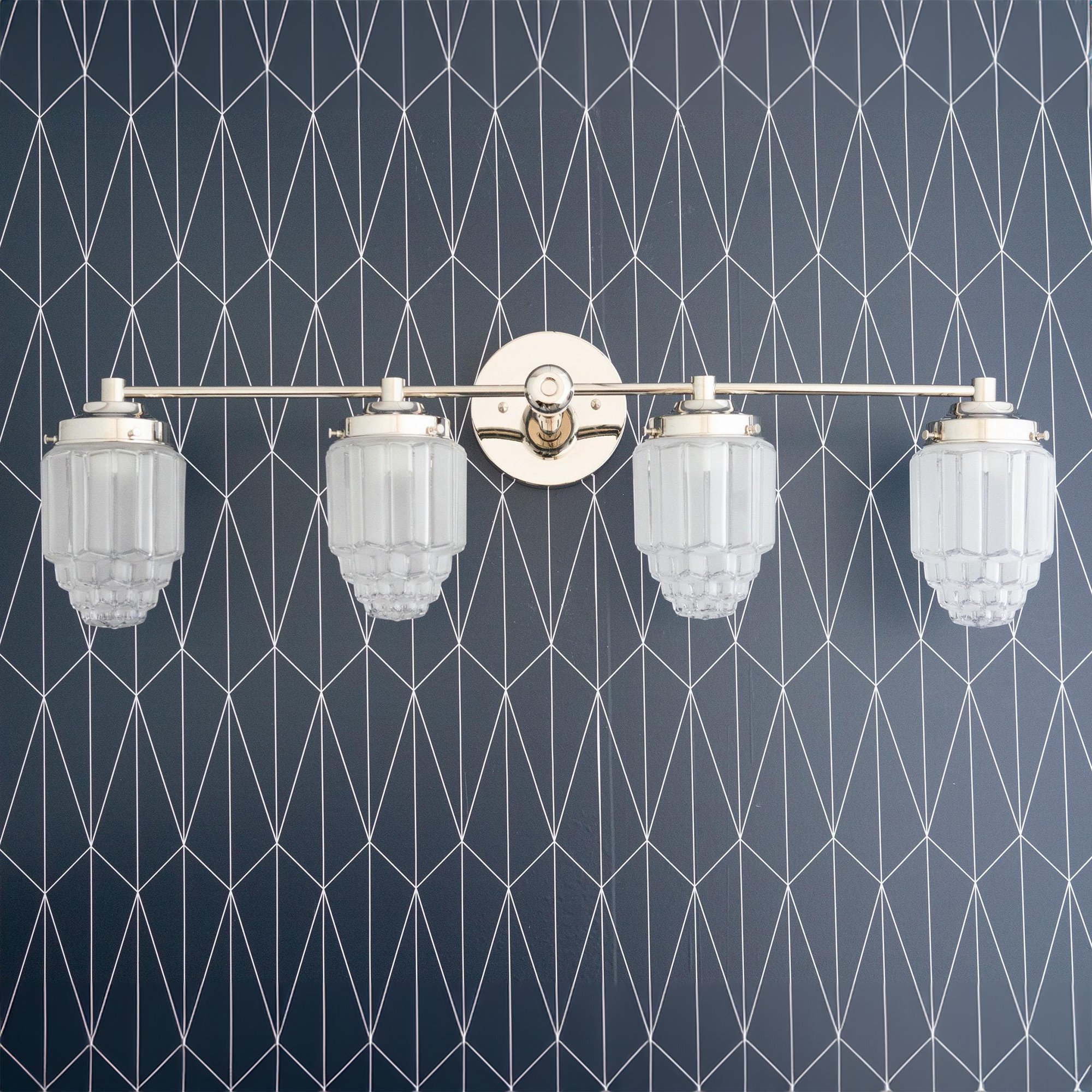 Polished nickel four-bulb vanity light with stepped glass globe shades and round wall mount. - VANITY LIGHT MODEL NO. 1082