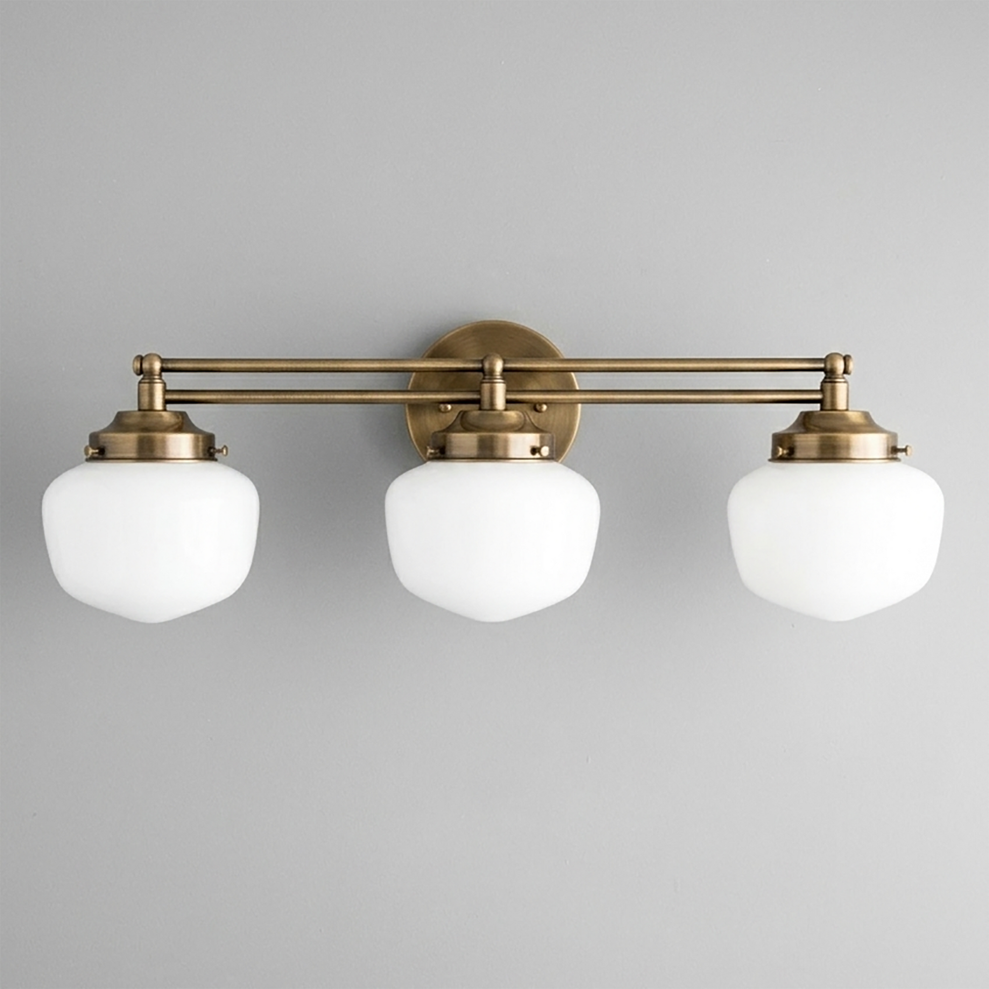 Three-bulb vanity light with antique brass finish and white globe shades in Art Deco style. - VANITY LIGHT MODEL NO. 4352