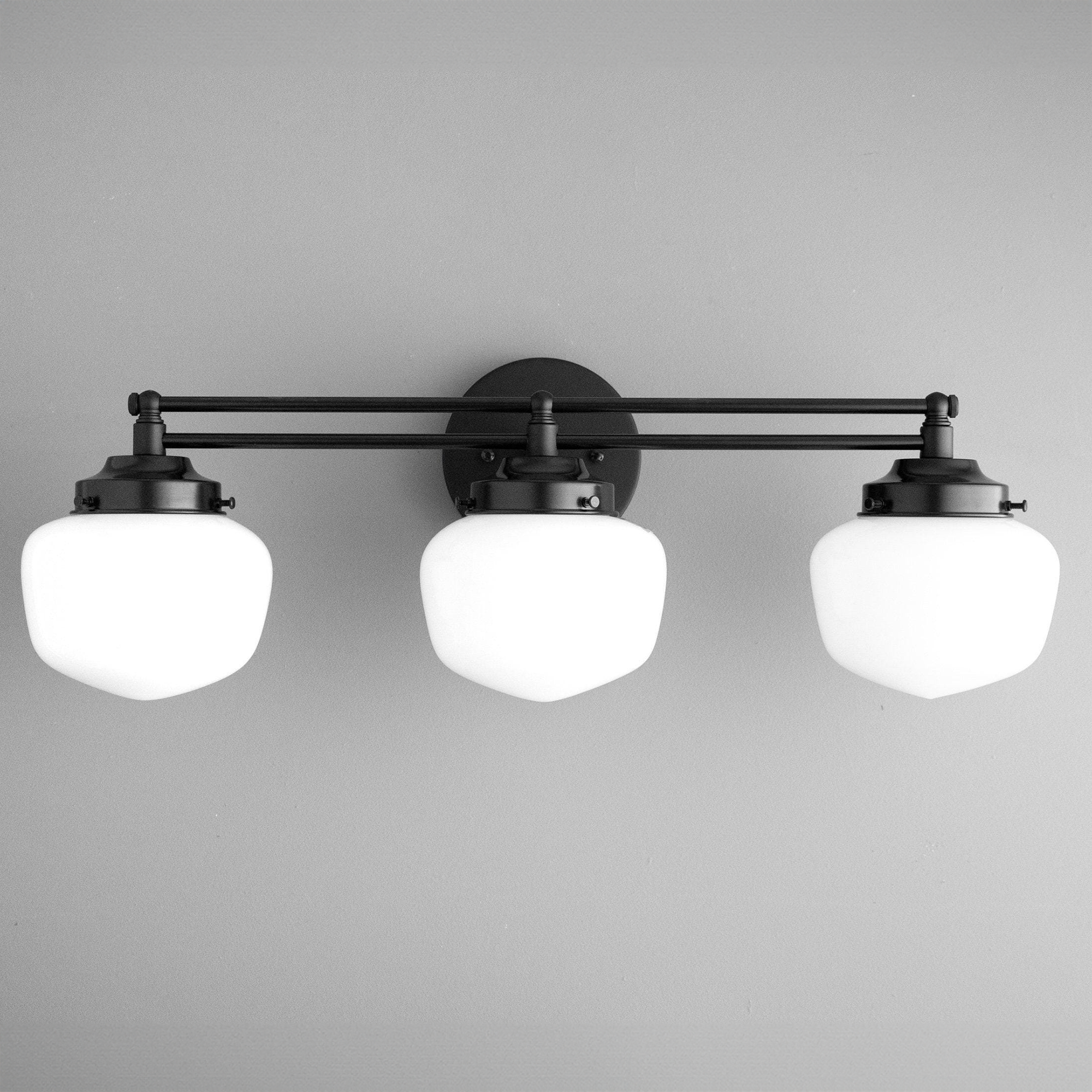 Three-bulb black metal vanity light with white globe shades in Art Deco style. - VANITY LIGHT MODEL NO. 4352