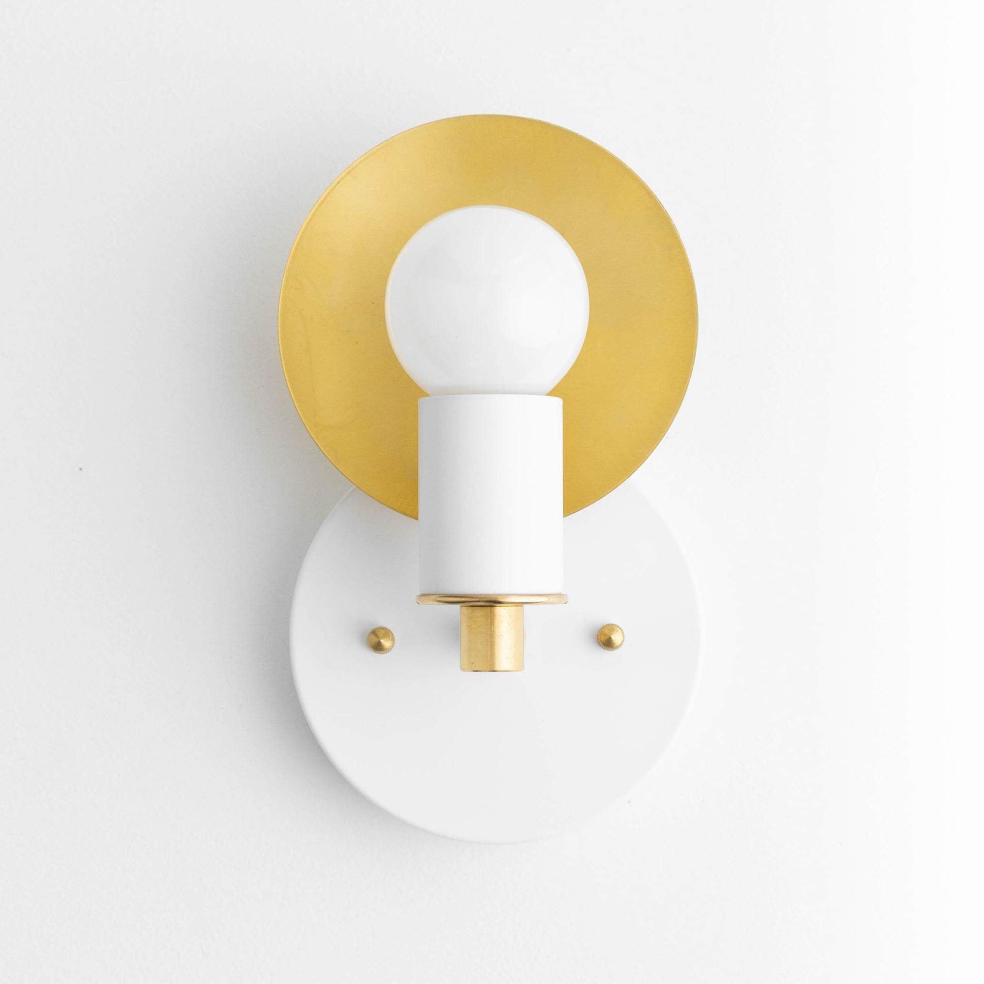 Art Deco style white and brass bare bulb wall sconce with round backplate and golden circular accent. - SCONCE MODEL NO. 8677