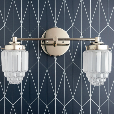 Polished nickel two-bulb vanity light with clear textured glass globes on geometric dark wall. - VANITY LIGHT MODEL NO. 9777