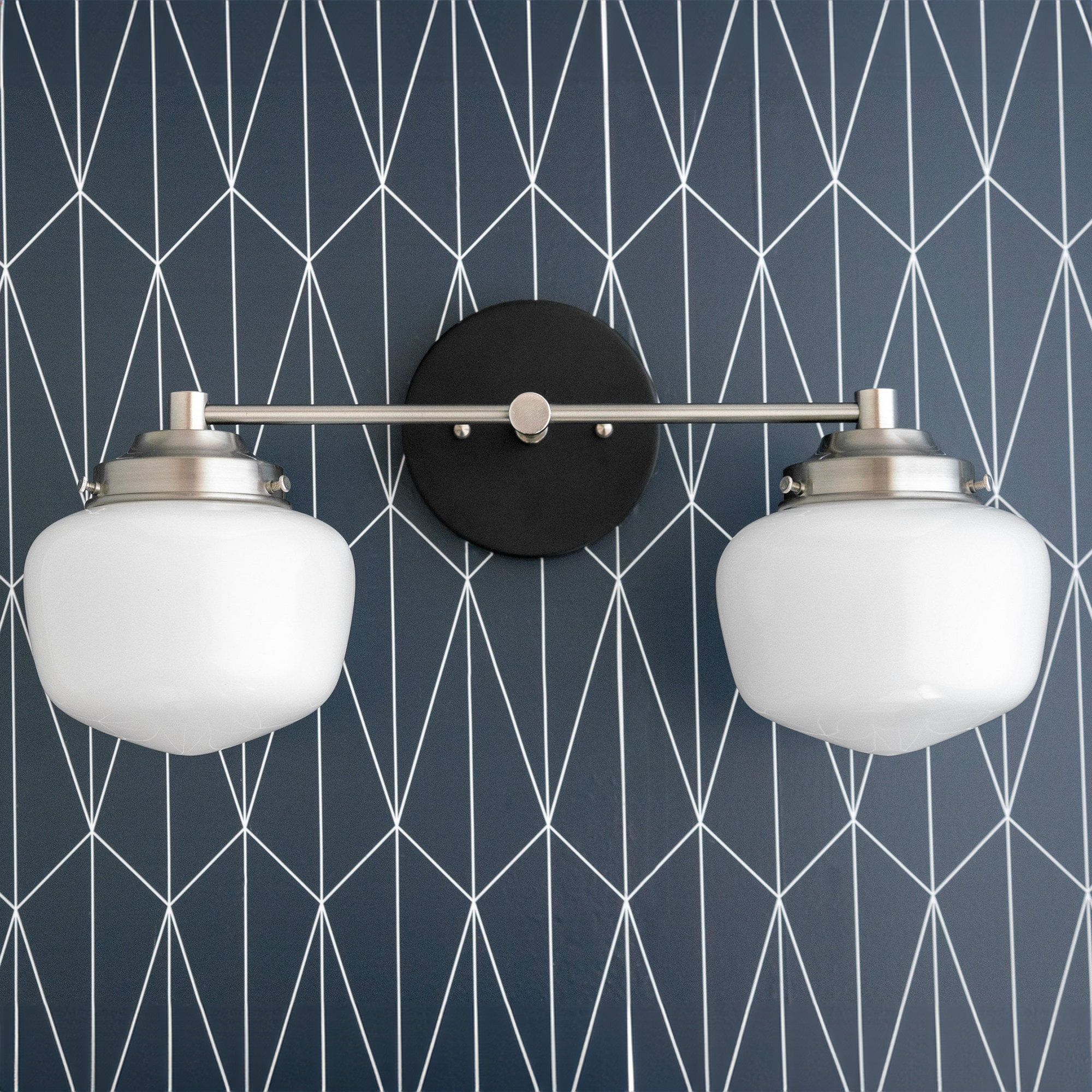 Mid-century modern two-bulb vanity light with black round backplate and brushed nickel globe shades. - VANITY LIGHT MODEL NO. 5799