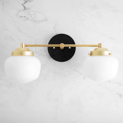 Mid-century modern 2-bulb vanity light with sealed brass finish and white globe shades on marble background. - VANITY LIGHT MODEL NO. 5799