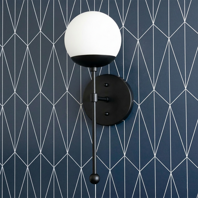 Art Deco style wall sconce with a white globe shade, black metal base, and slender vertical rod with round finial. - SCONCE MODEL NO. 1048