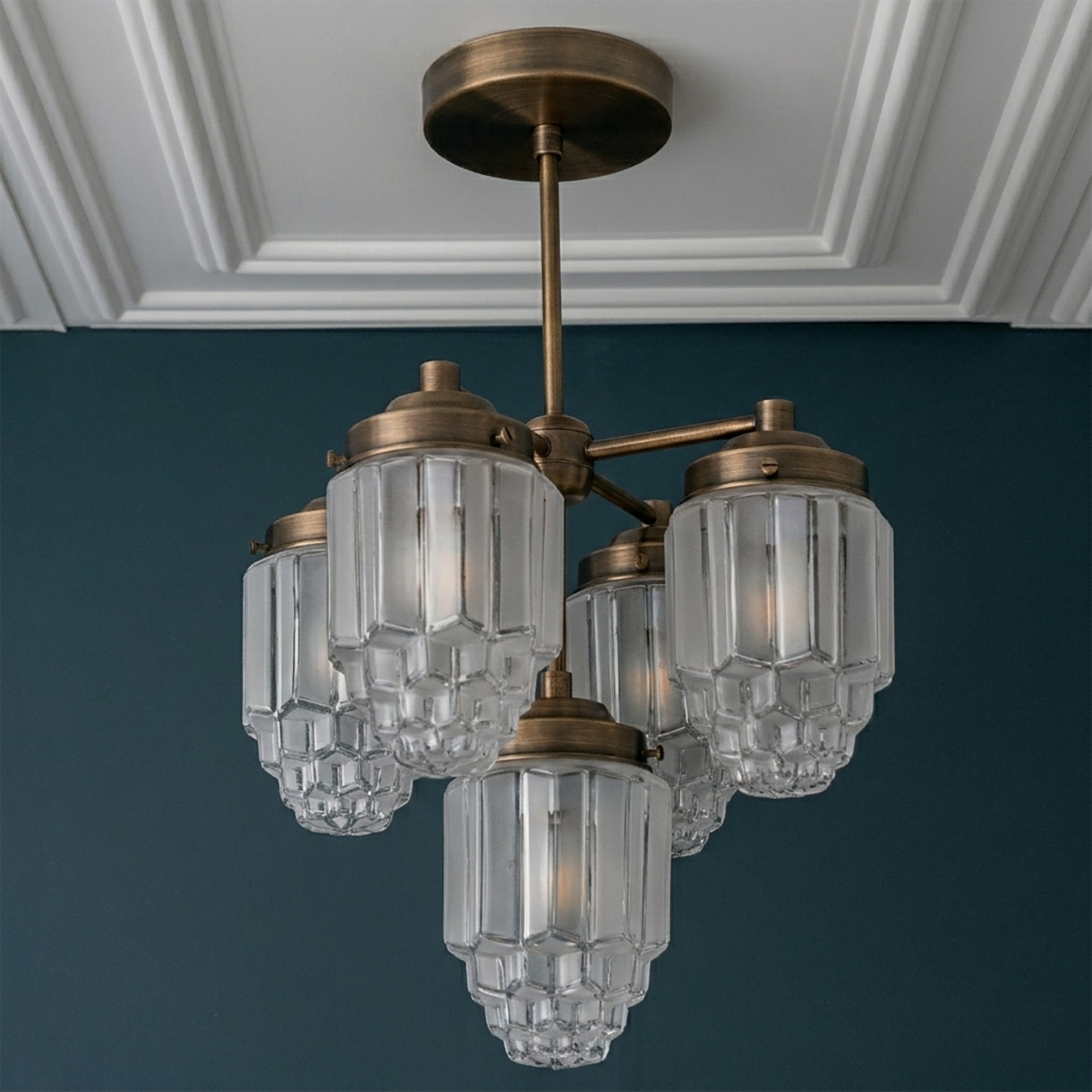 Art Deco chandelier with five bronze arms and tiered clear glass globe shades hanging from brass fixture. - CHANDELIER MODEL NO. 0777