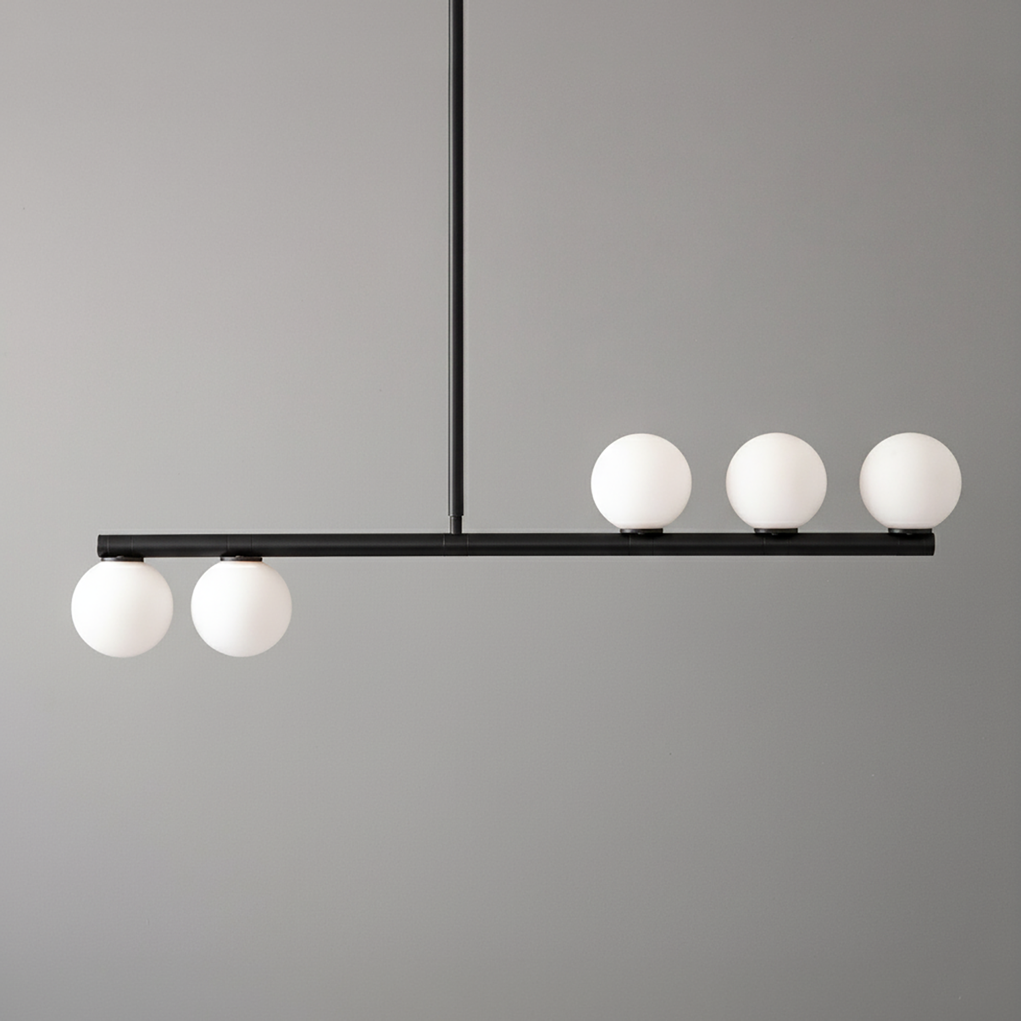 Minimalist black linear chandelier with five white globe lights in a balanced arrangement. - CHANDELIER MODEL NO. 6507