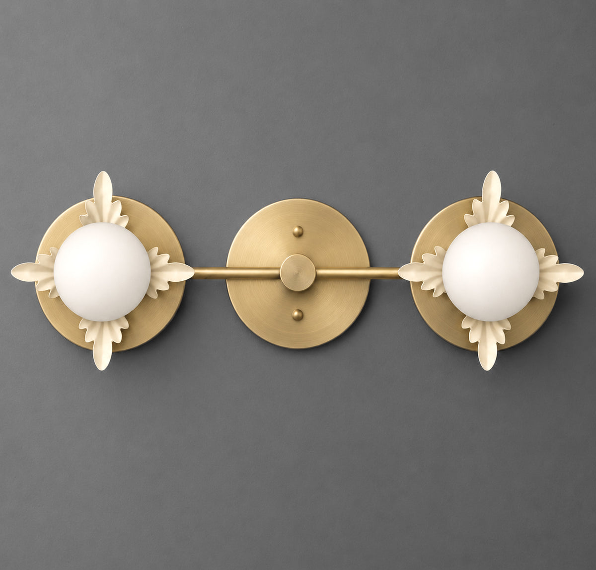 Two-light vanity light in Raw or Sealed Brass with Cream leaf accents around opal glass globes on round backplates joined by a straight bar. - VANITY LIGHT MODEL NO. 1118