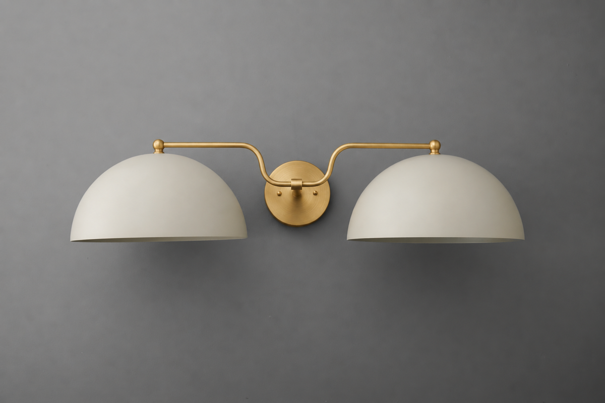 Modern vanity light with two matte white dome shades and a brushed brass mounting plate and arms. - VANITY LIGHT MODEL NO. 1160
