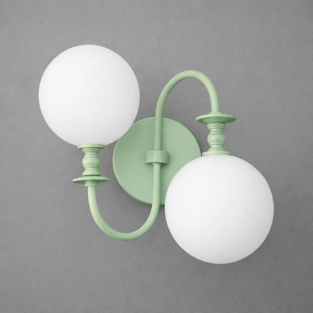 Matte green metal double-arm wall sconce with two white spherical glass shades. - SCONCE MODEL NO. 2429