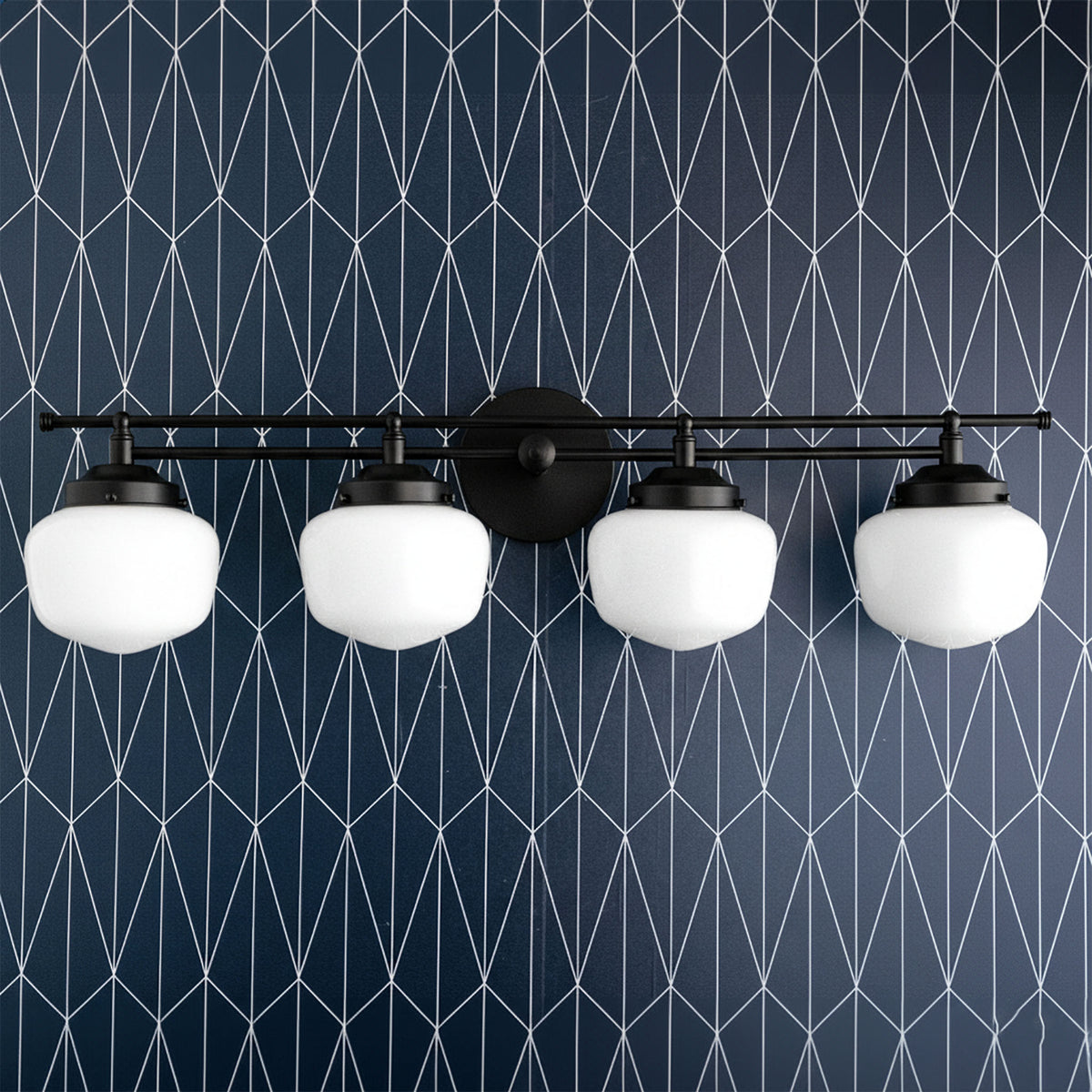 4-bulb black vanity light with rounded white globe shades mounted on geometric navy blue wall. - VANITY LIGHT MODEL NO. 9054