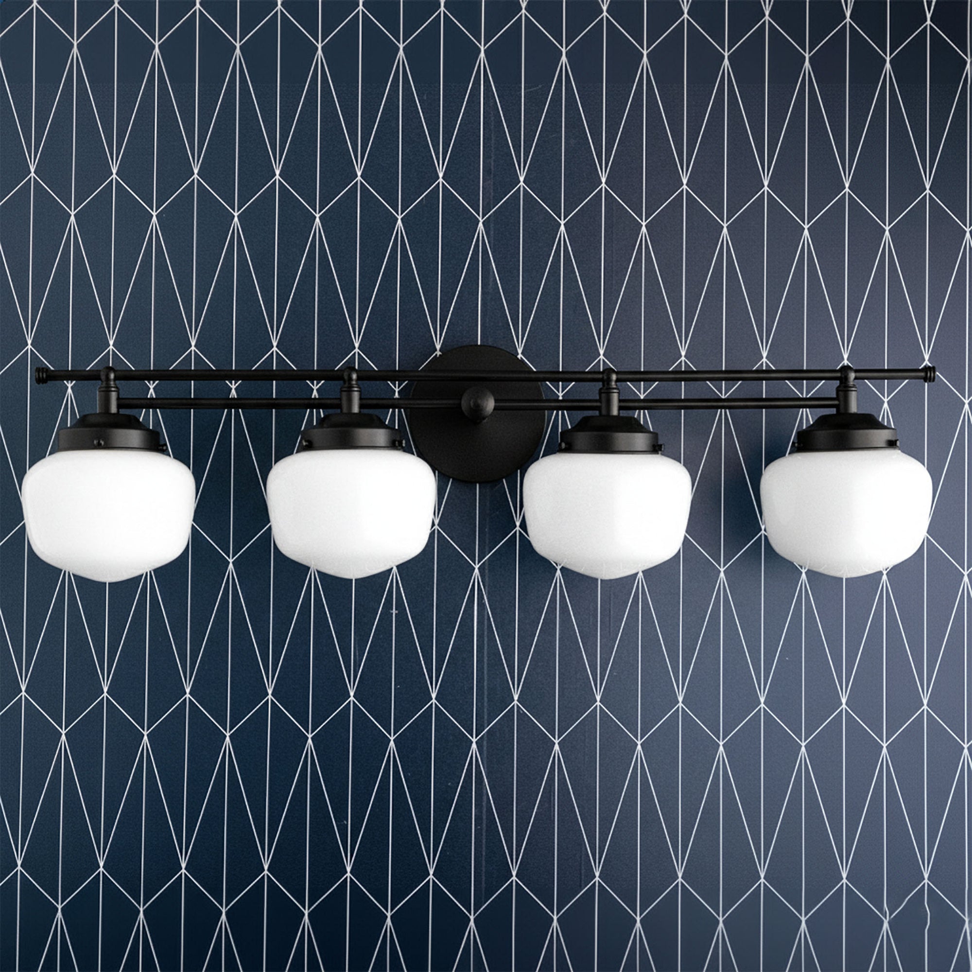 4-bulb black vanity light with rounded white globe shades mounted on geometric navy blue wall. - VANITY LIGHT MODEL NO. 9054