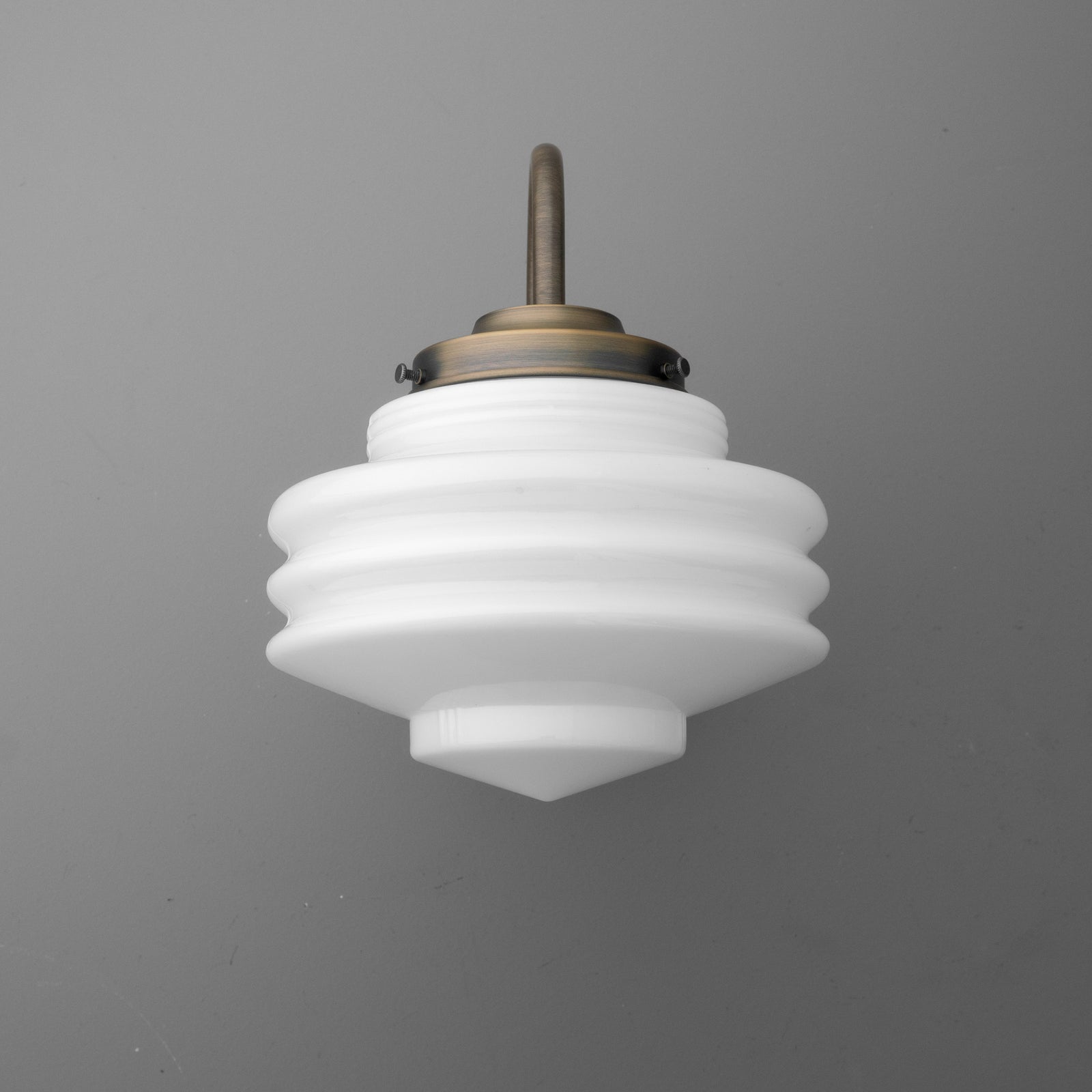 White layered glass sconce with bronze metal fixture and a concentric stepped design. - SCONCE MODEL NO. 1096