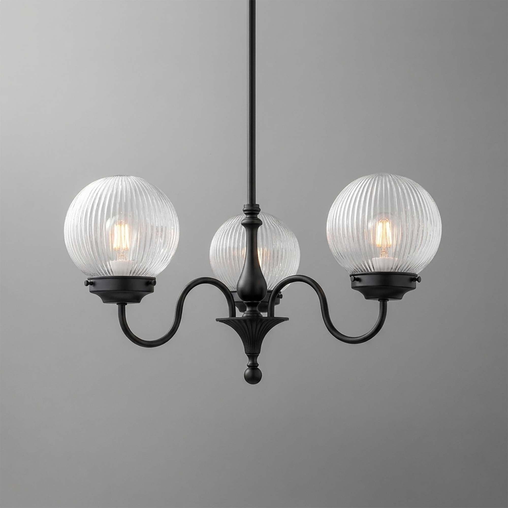 Black metal chandelier with three ribbed clear glass globe shades and curved arms. - CHANDELIER MODEL NO. 2894