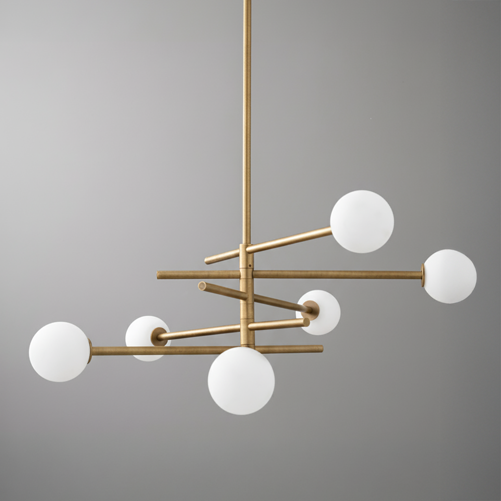 Modern chandelier with six frosted white glass globes on matte gold metal rods in a balanced, geometric design. - CHANDELIER MODEL NO. 8576